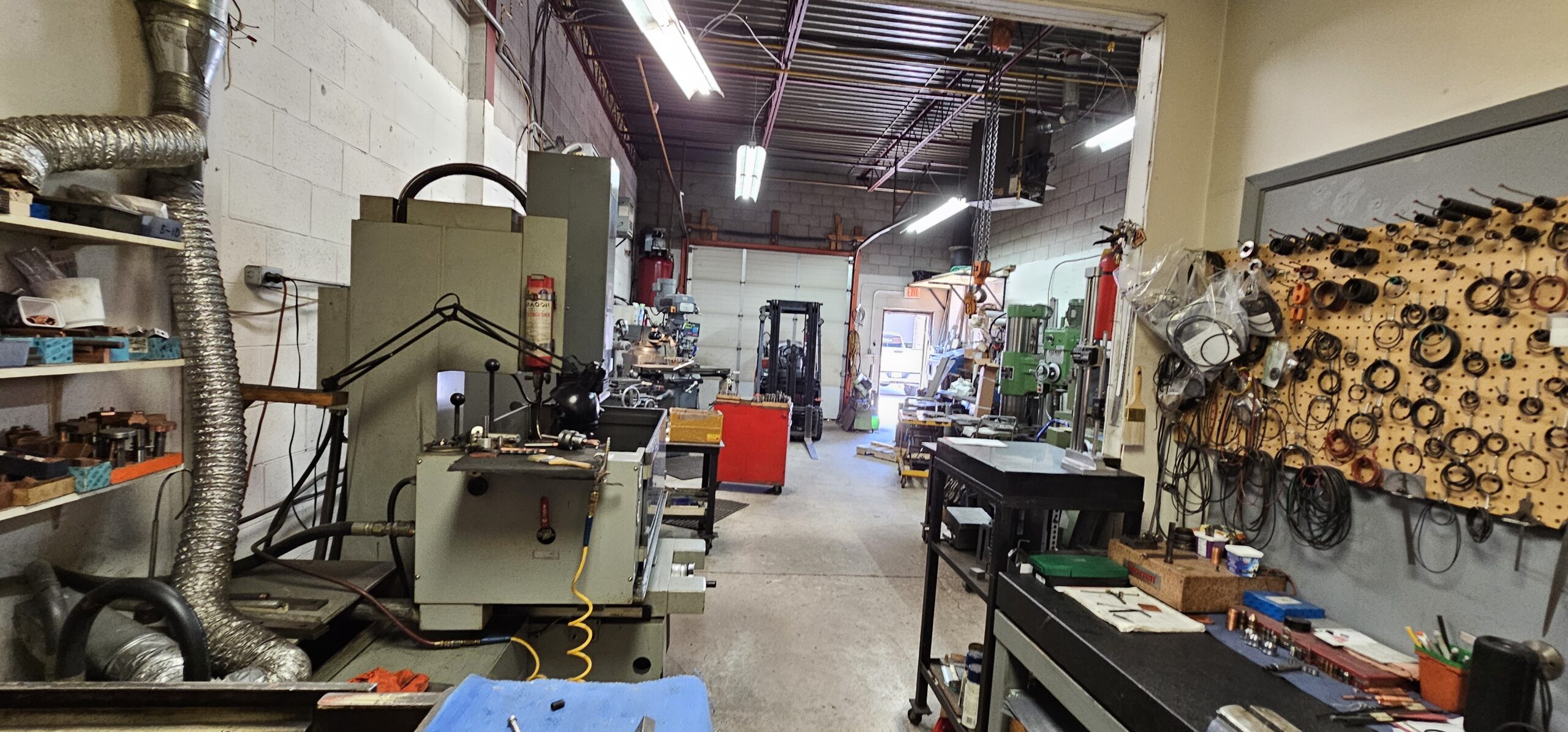Interior of a workshop with machinery and tools along the walls