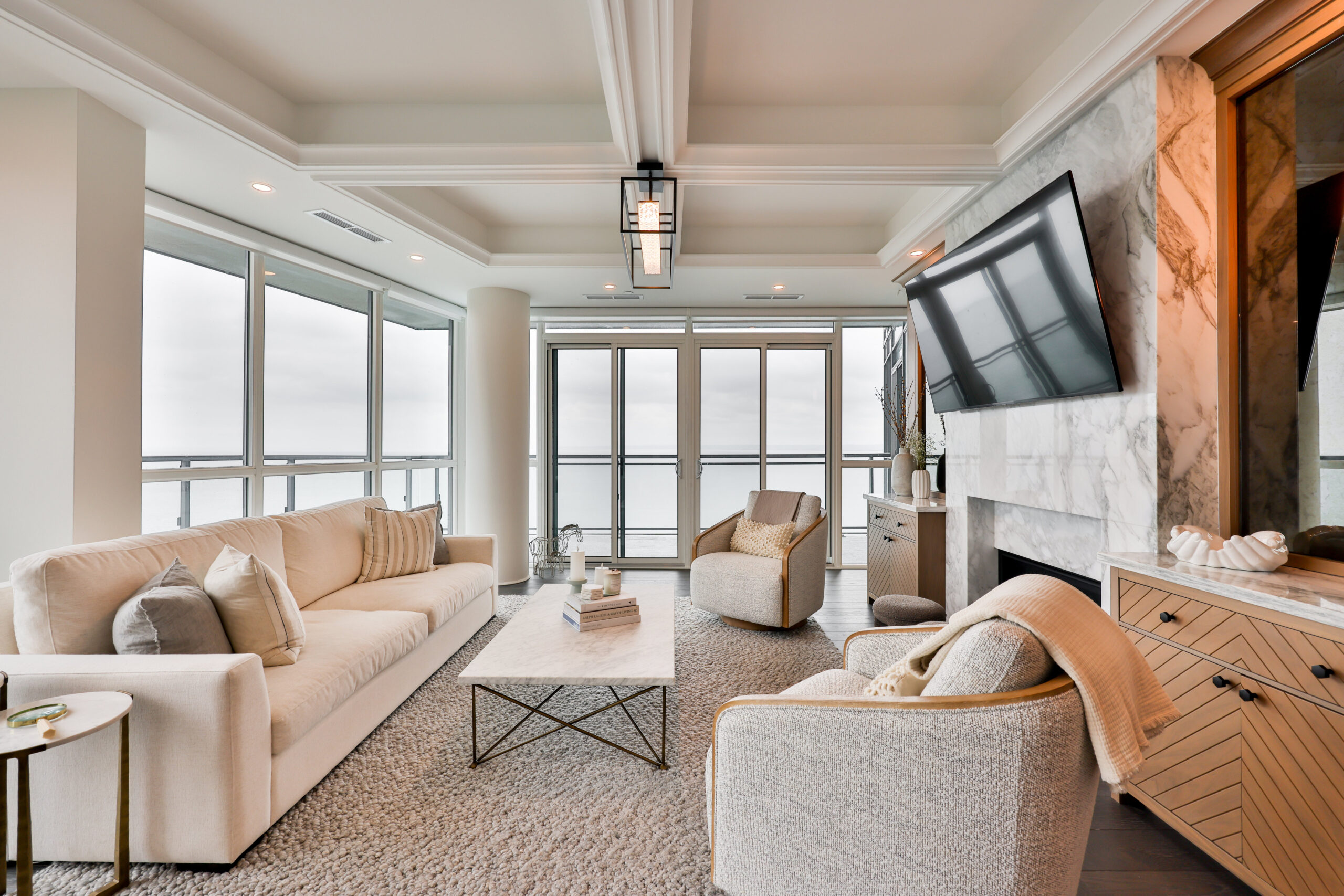family room with built in cabinetry and fire place