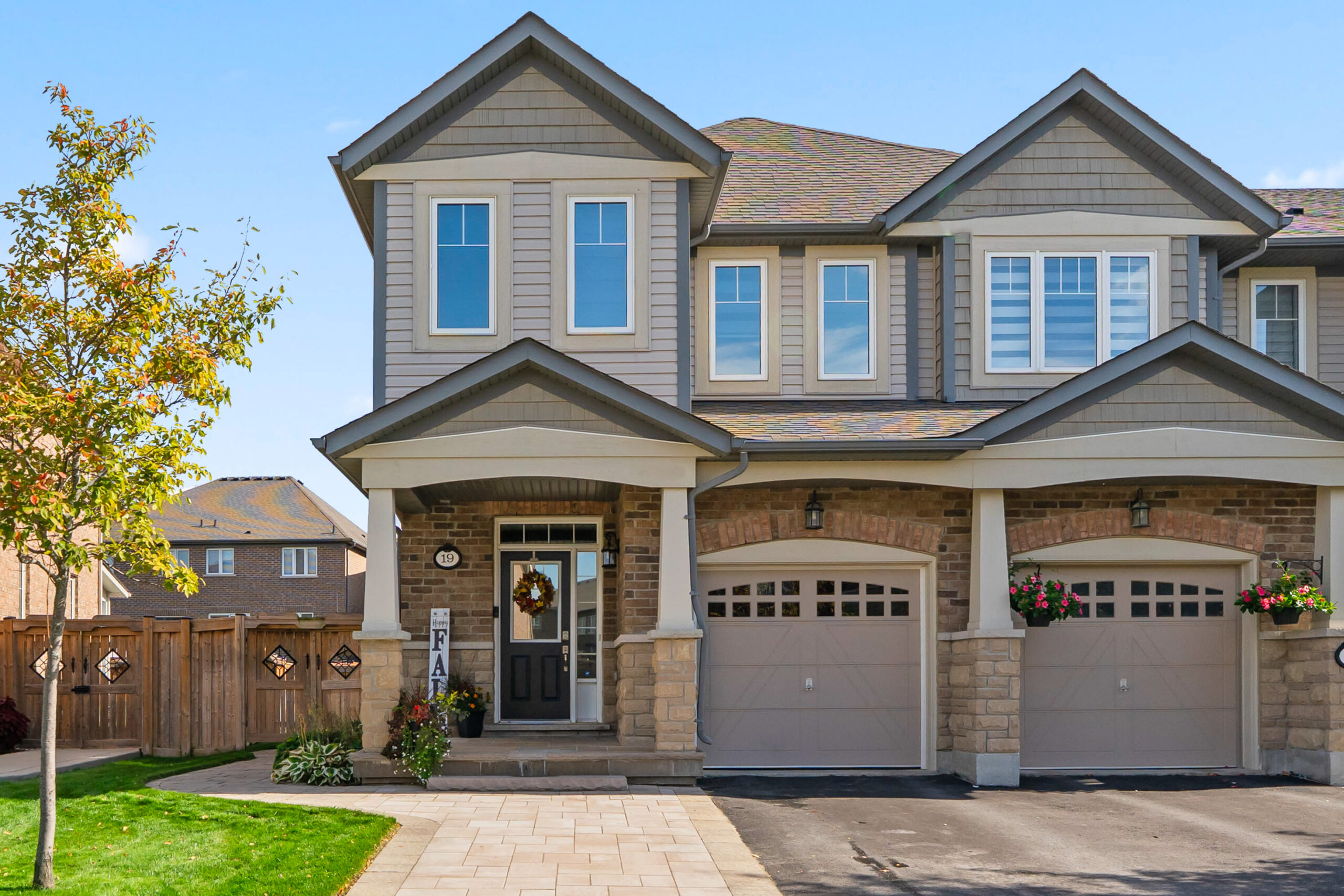 Front house photo showing driveway and walk way to door