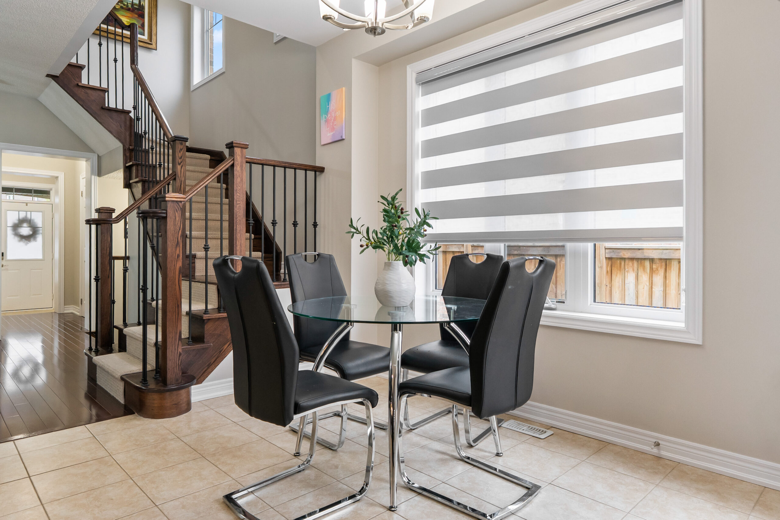 breakfast area with large window. Custom stair way leading to the second floor