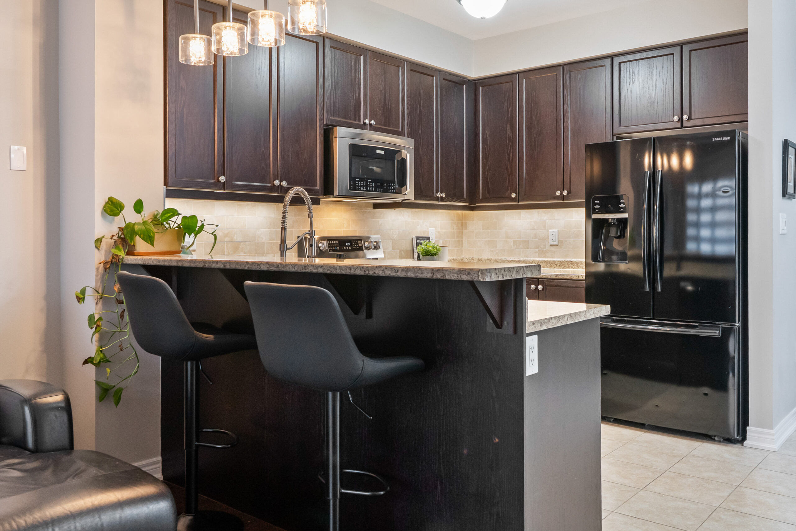 kitchen with bar chairs for eating