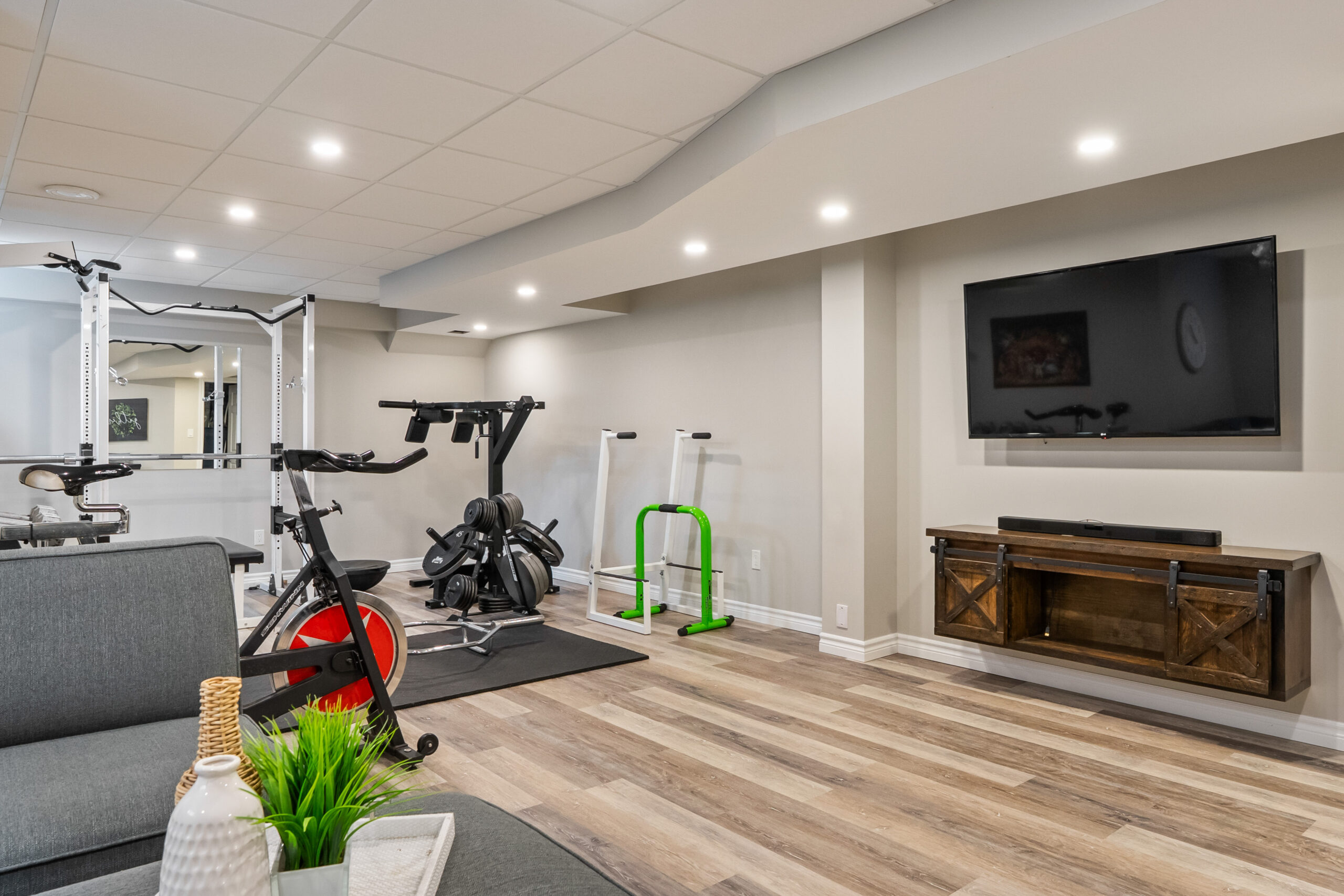 basement recreation room with gym