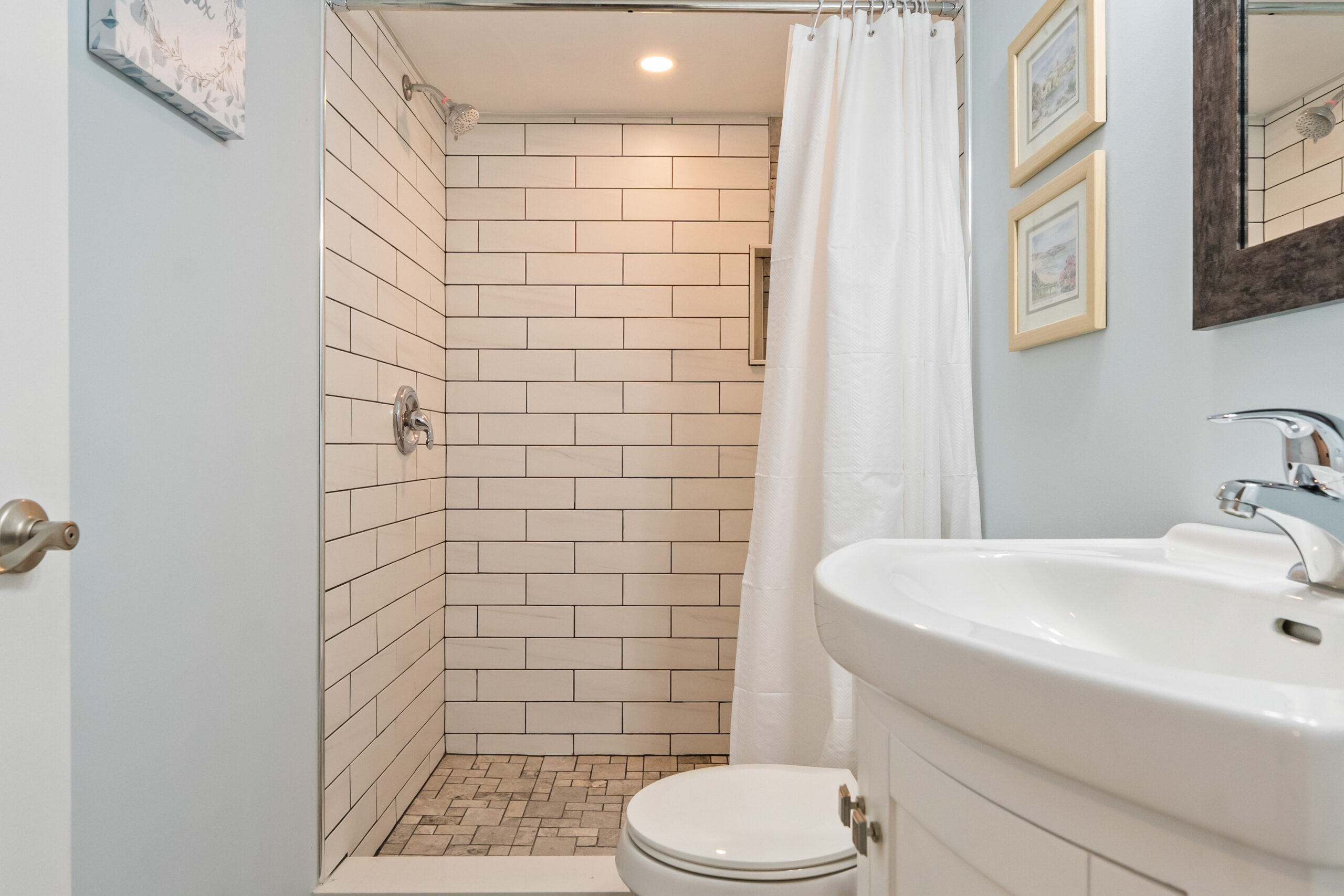 basement bathroom with walk in shower