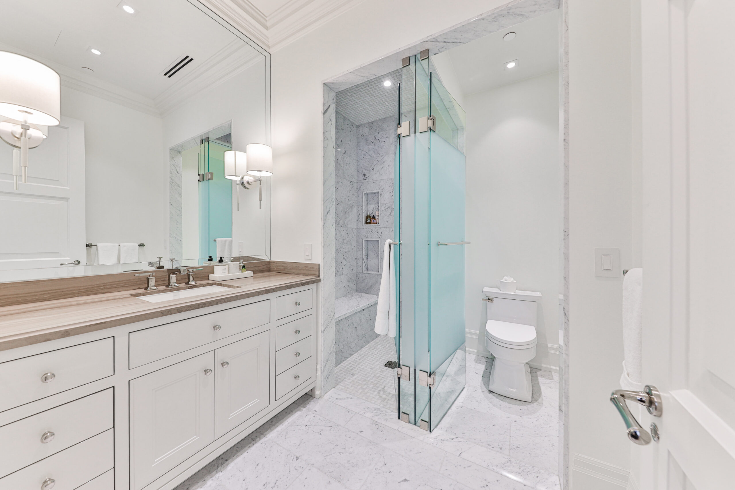 bedroom ensuite with walk in shower. seperate glass door to private toilet area