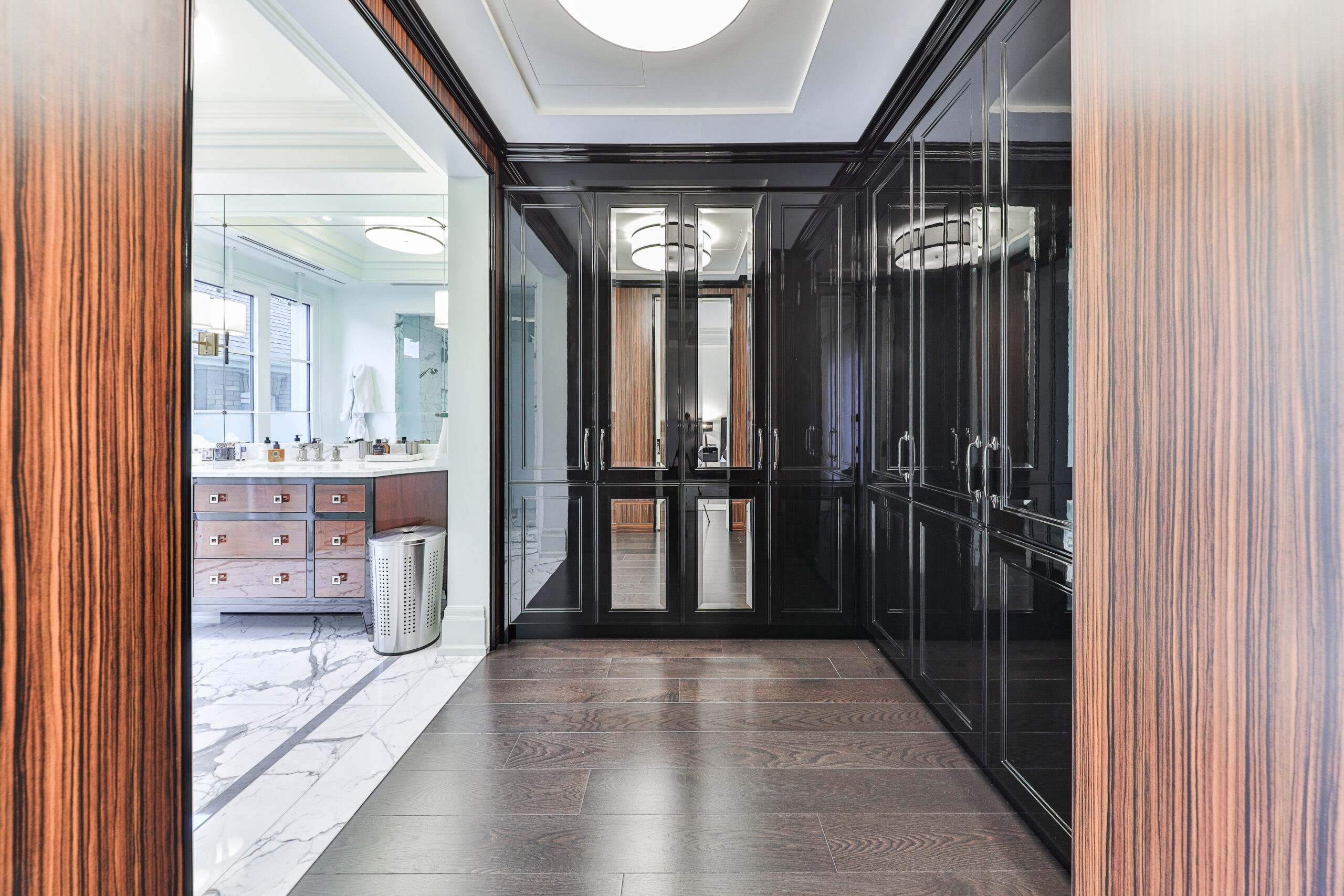 large walk in black closet off of the ensuite