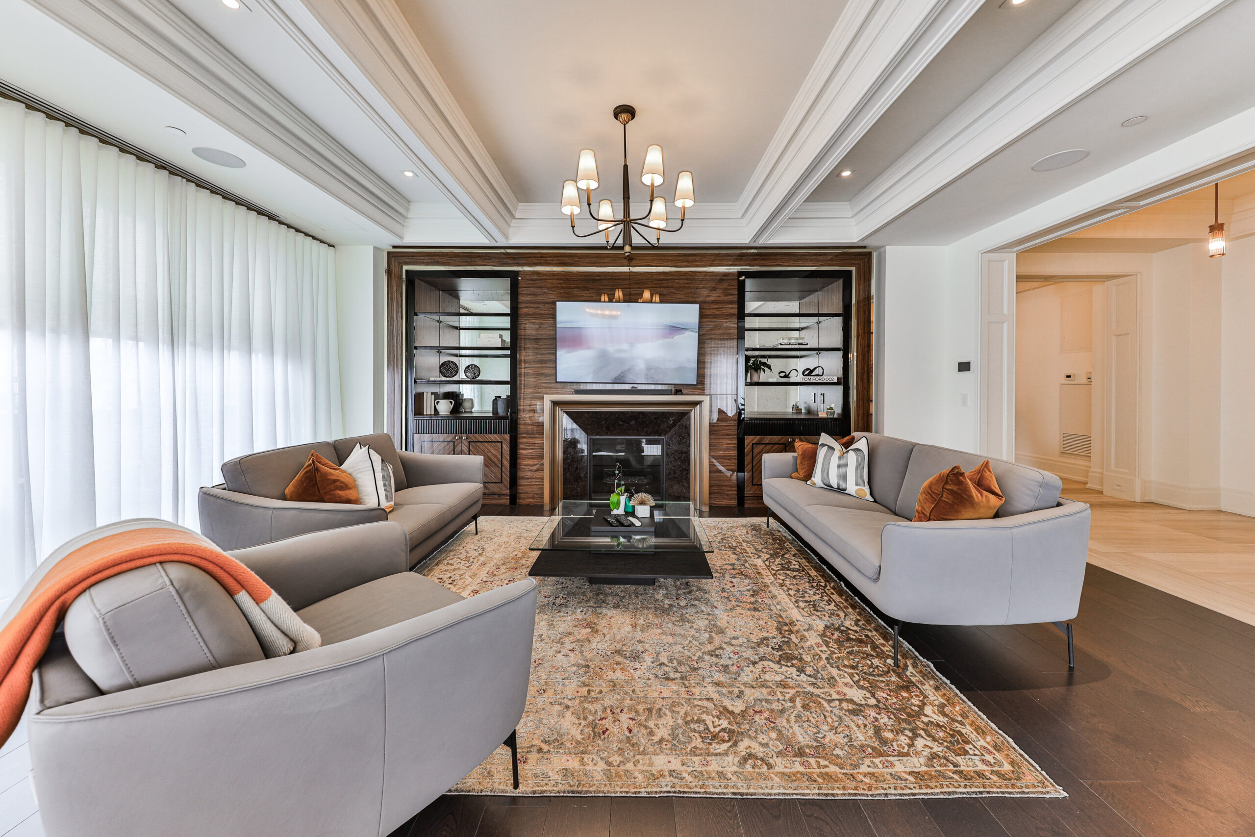 family room with large windows allowing plenty of light in.