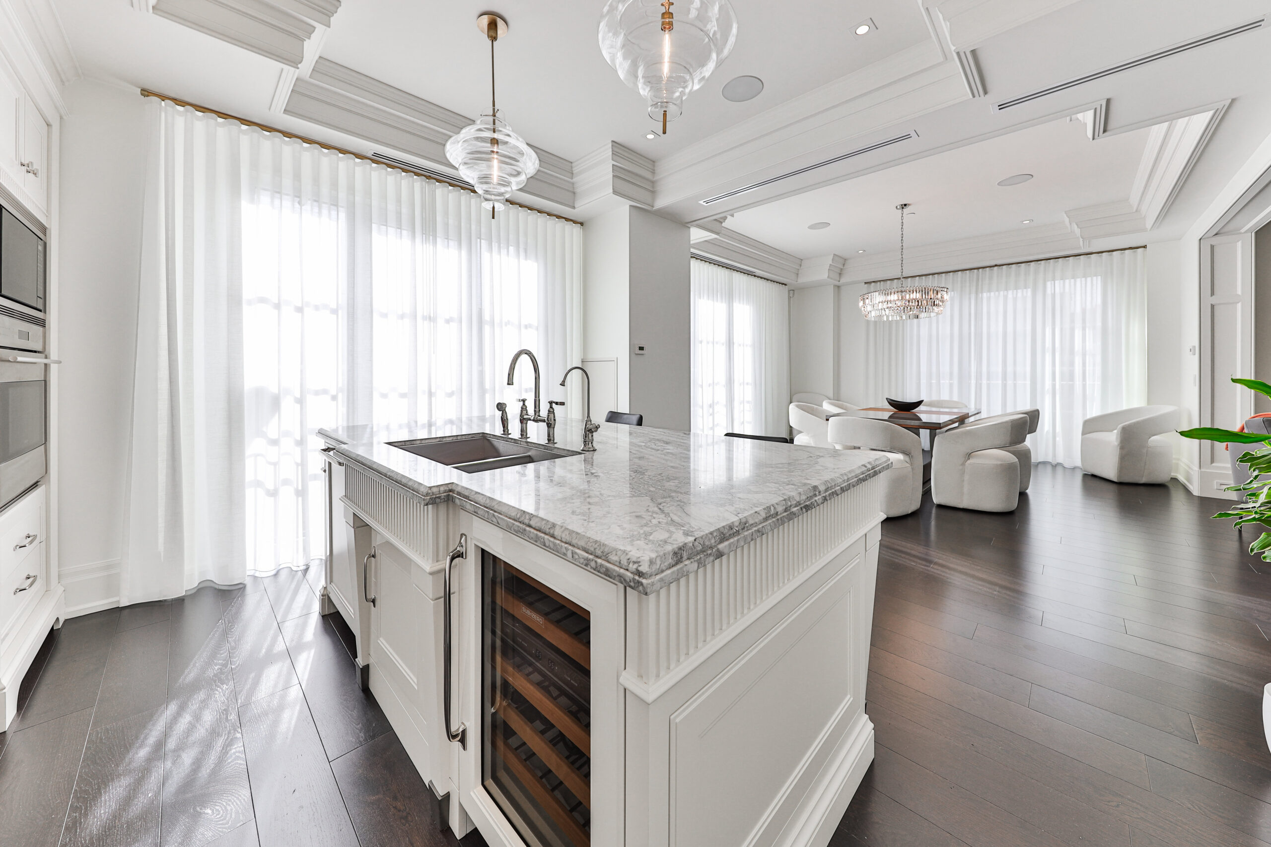 wine fridge, sink built into the island