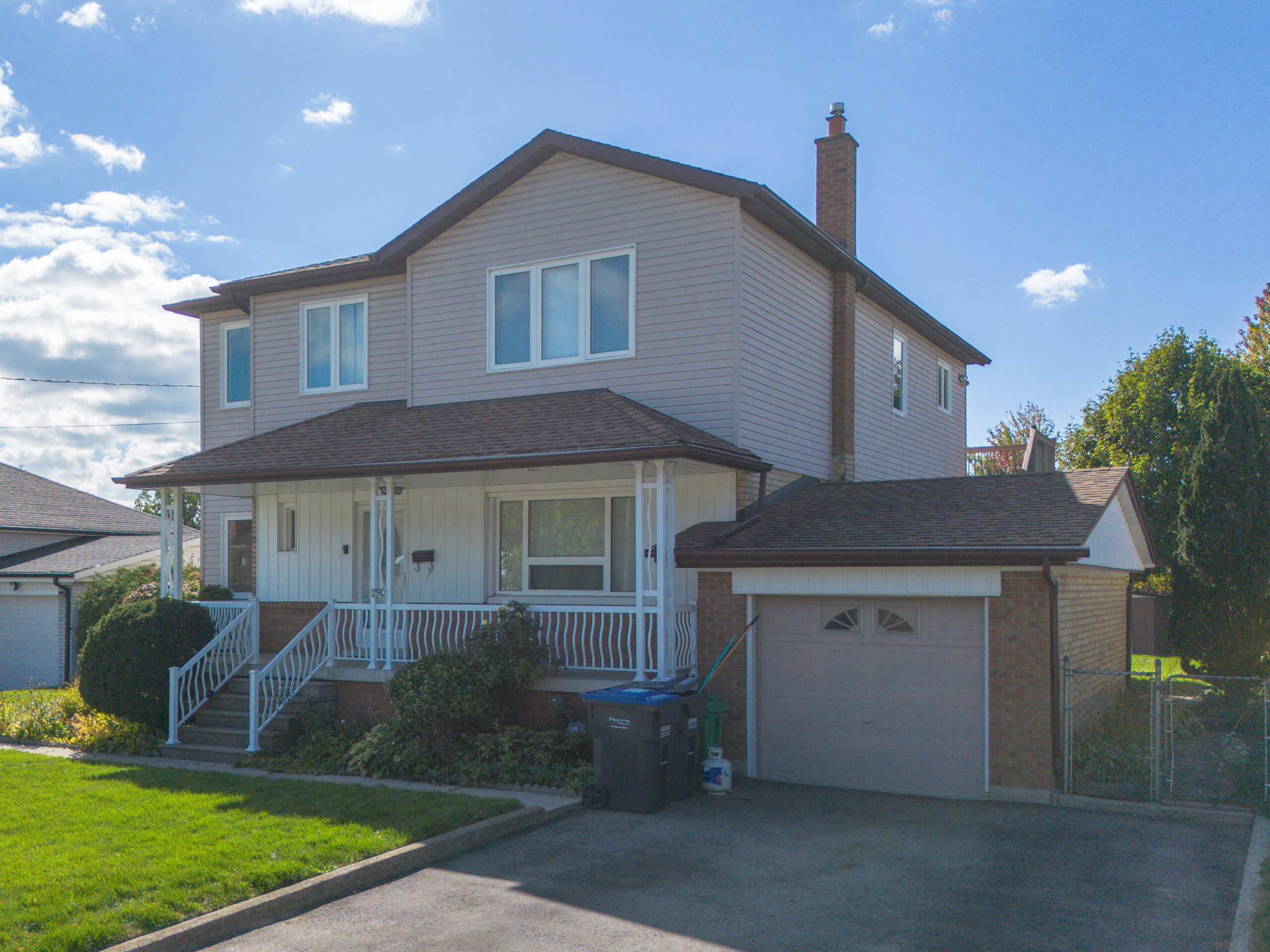 side view of house with stone walk way to front door