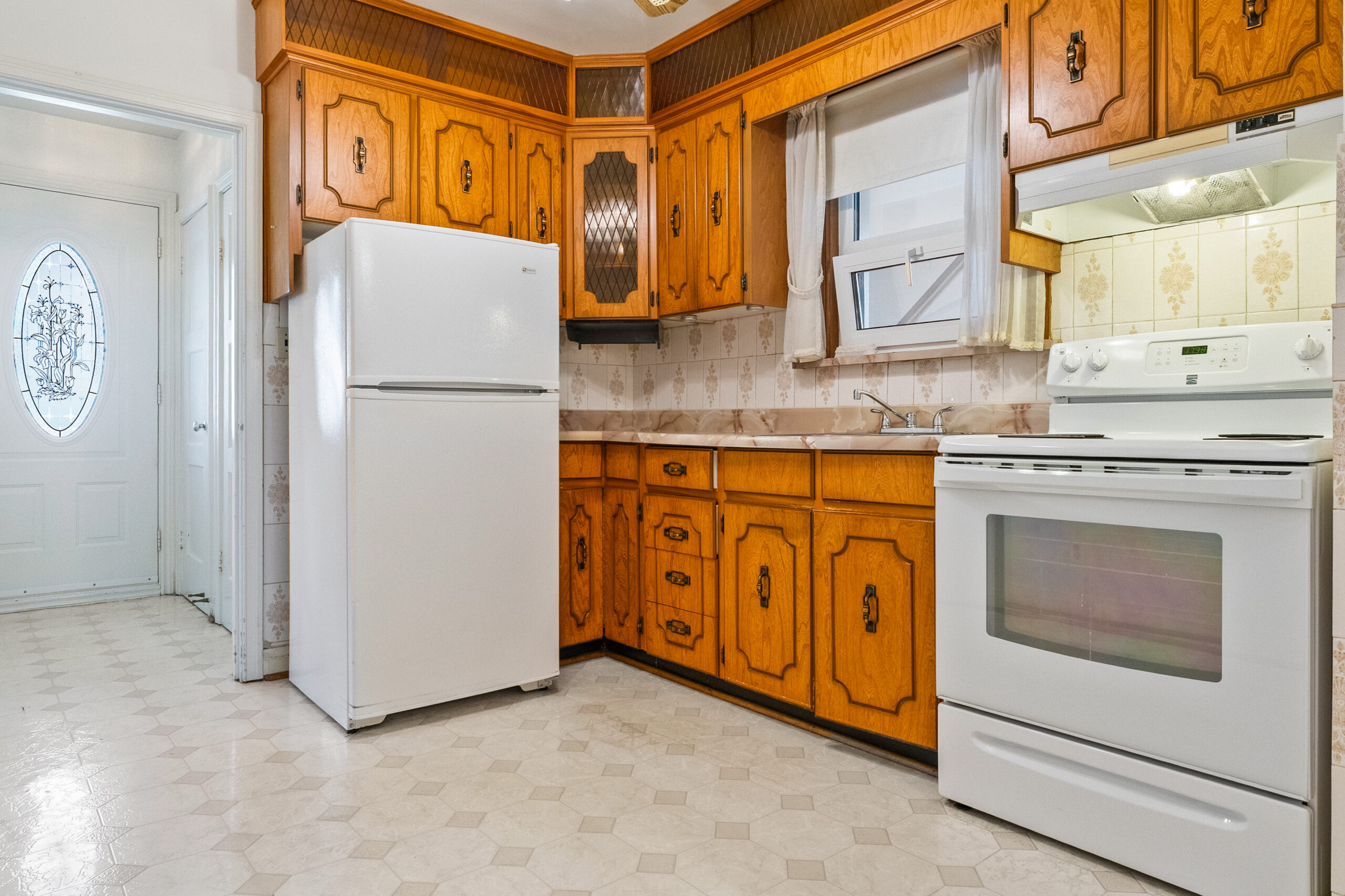 large open kitchen with matching white appliances