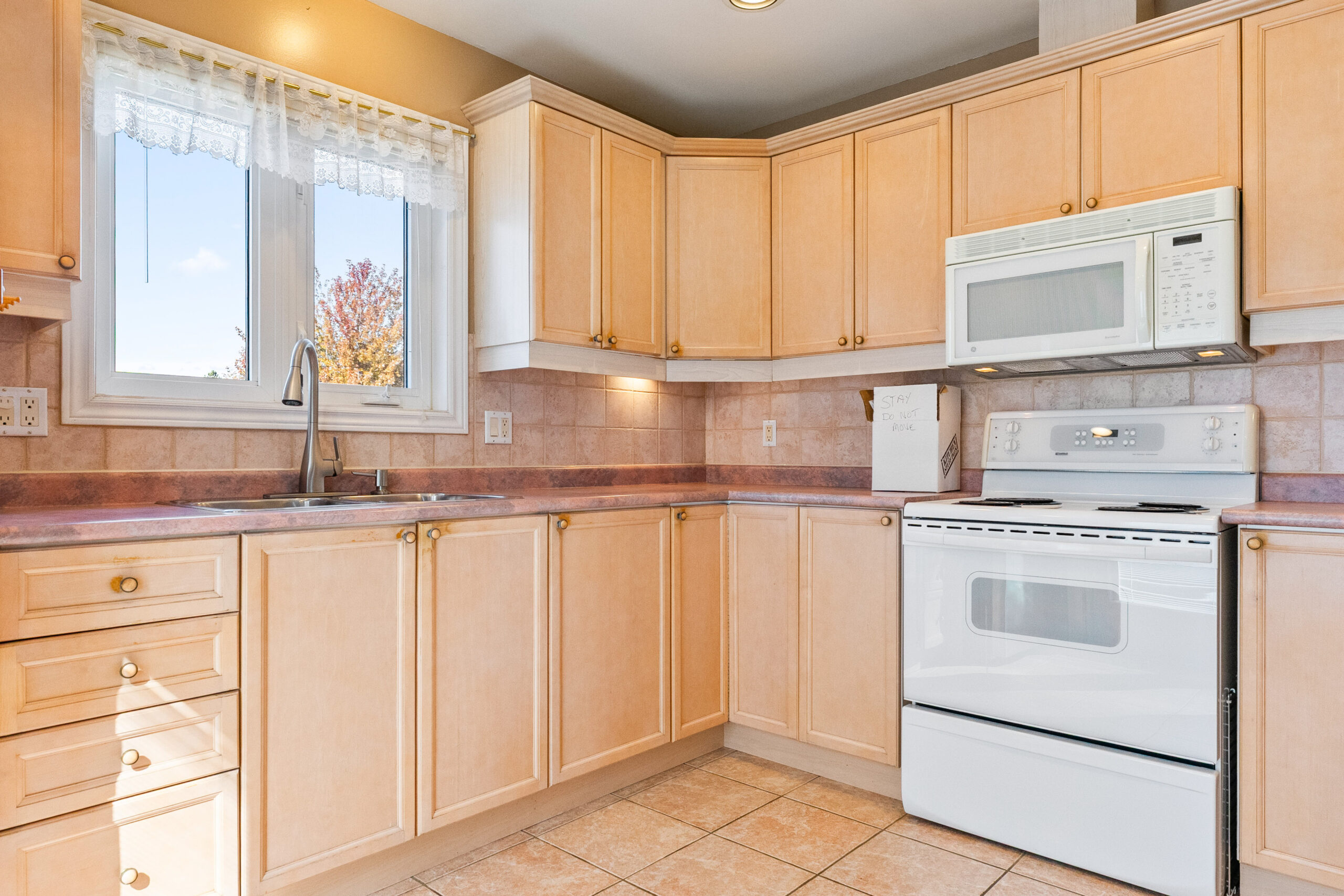 kitchen photo with large window over sink