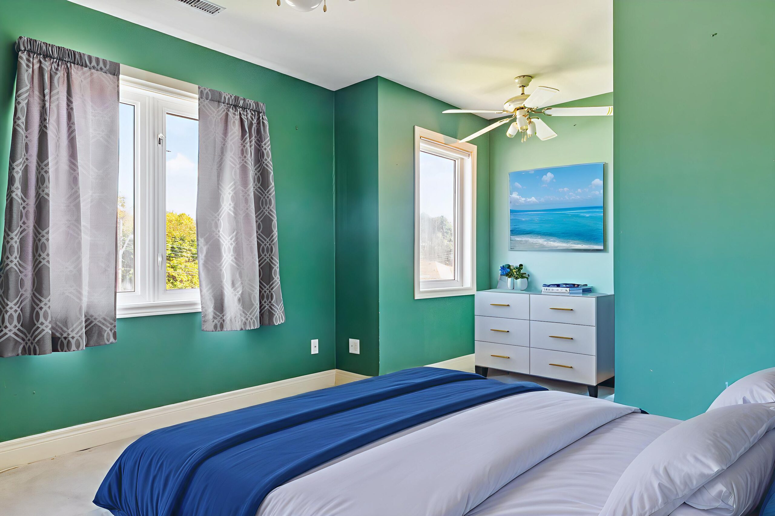guest room with ceiling fan and two windows