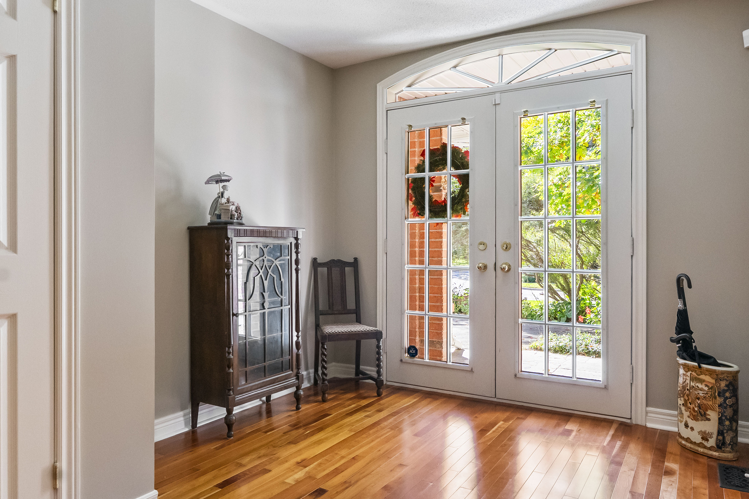 large french door foyer allowing plenty of natural light