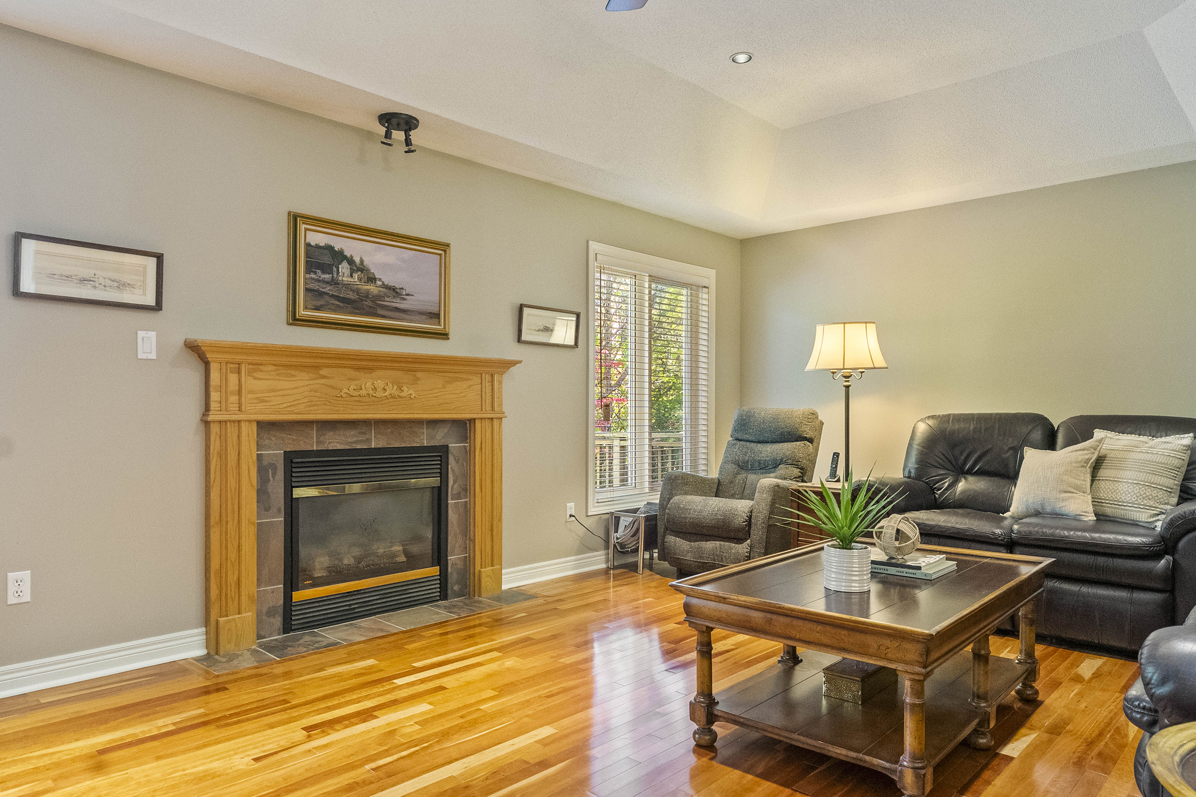 Family room with large fireplace and plenty of seating