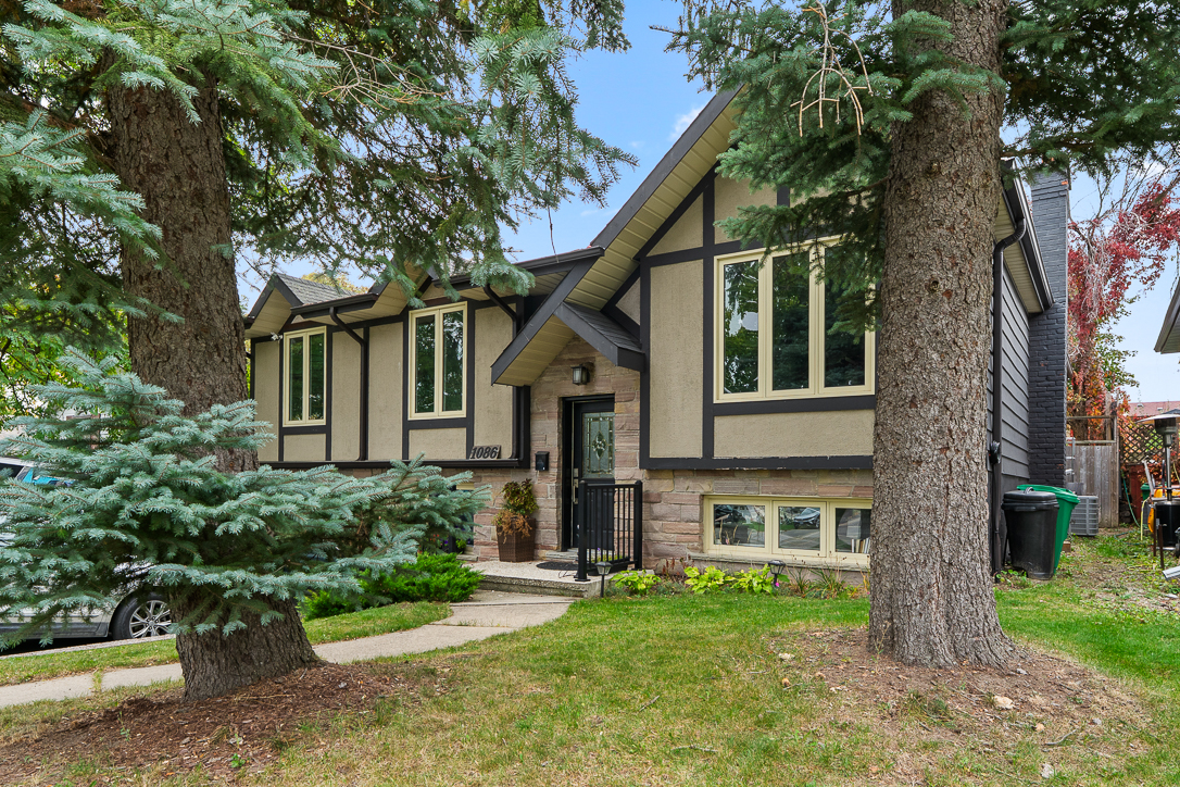 side shot of house showing beautiful mature trees