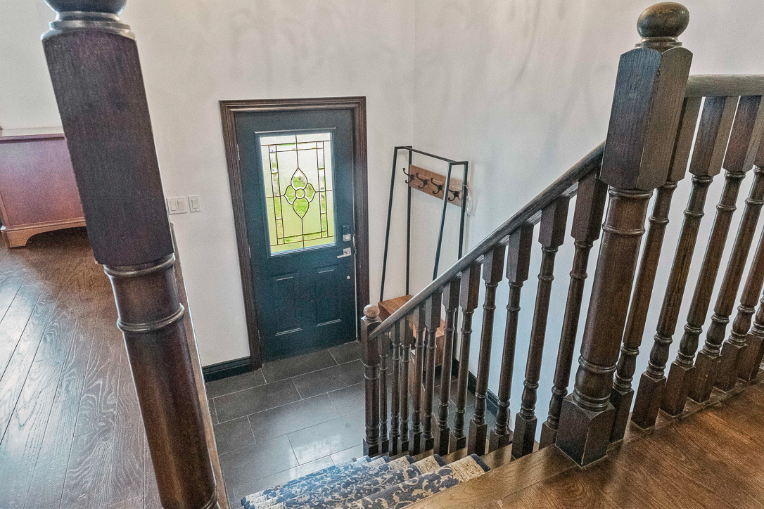 front door foyer with access to upper and lower levels