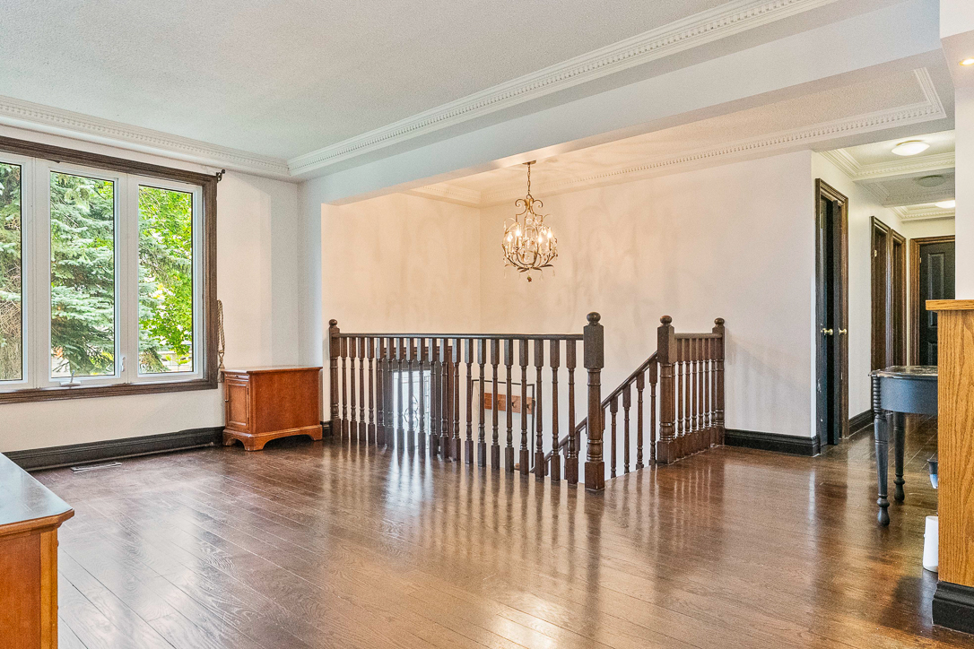 living room featuring wood stair hand rails