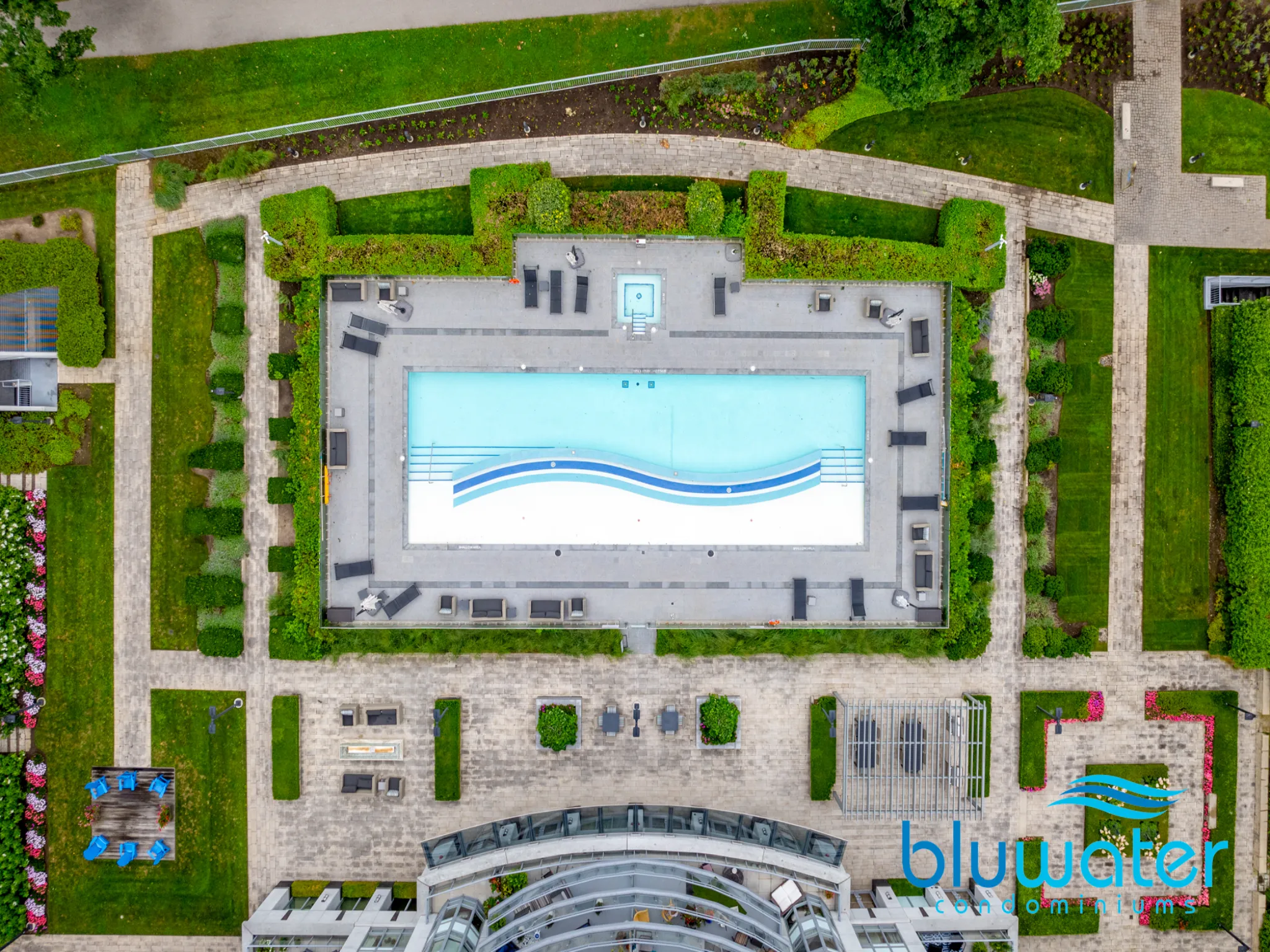 aerial shot of the pool surrounded by gardens and greenscape