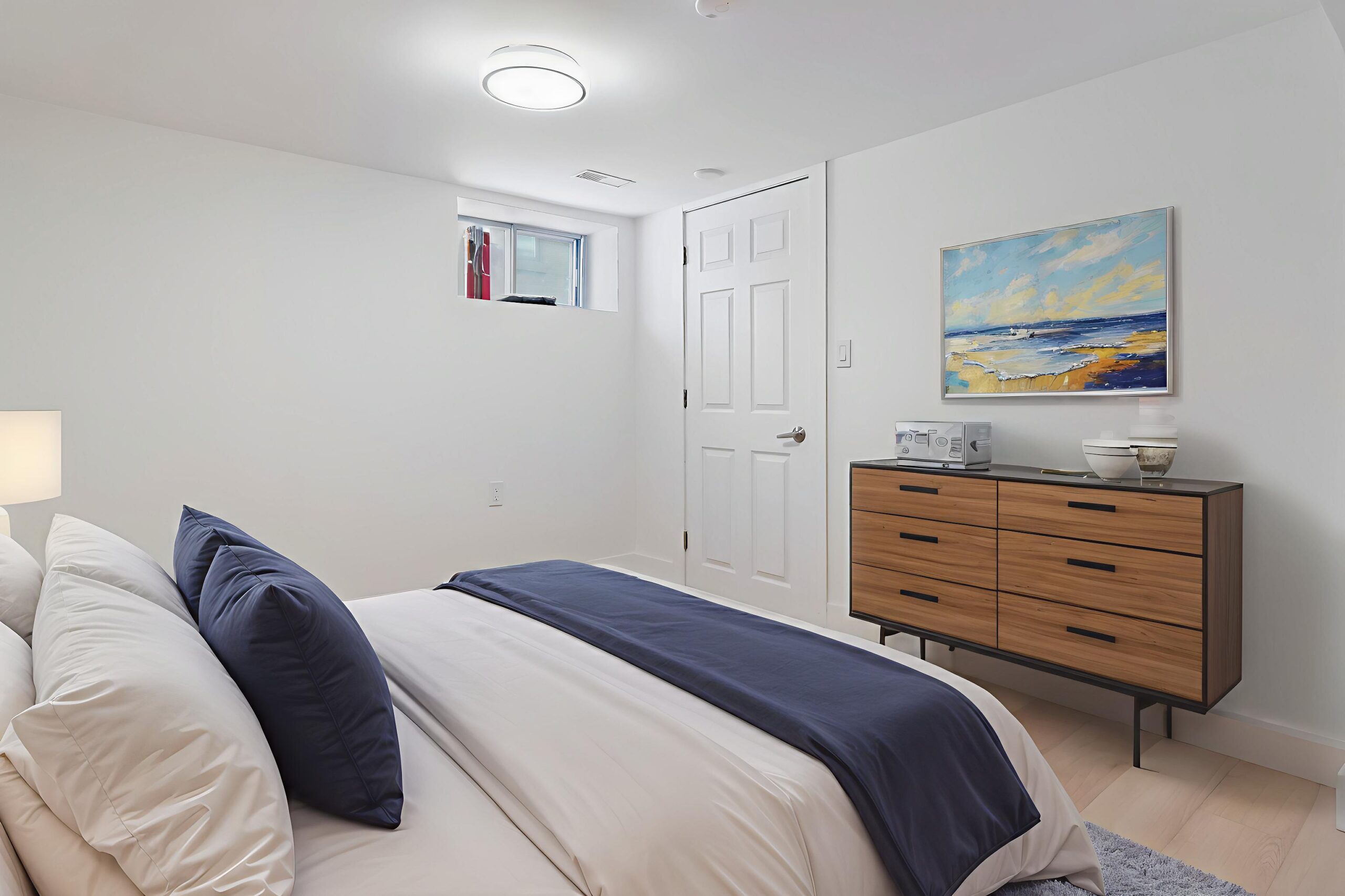 large bedroom with window and closet