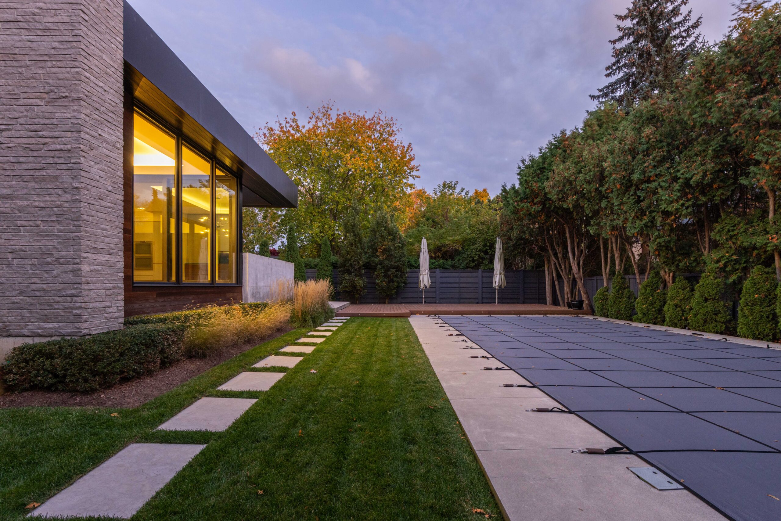 large in ground pool in backyard