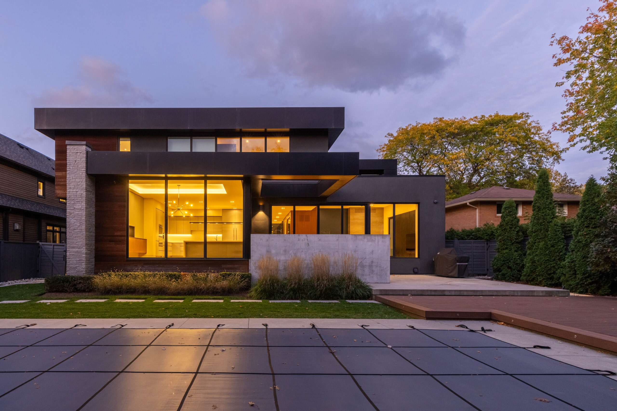 back view of house with pool and deck