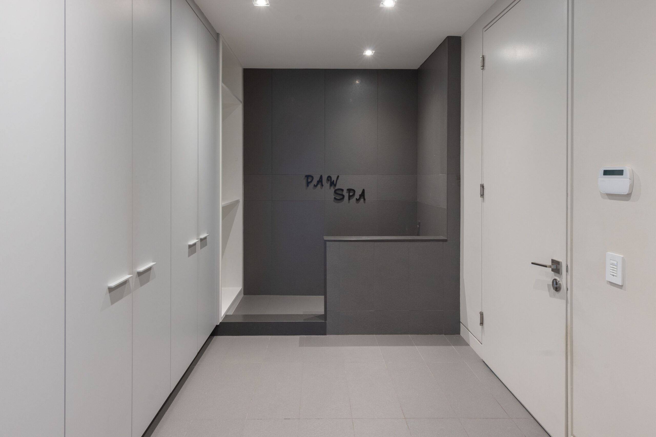 mud room featuring dog wash and access to garage