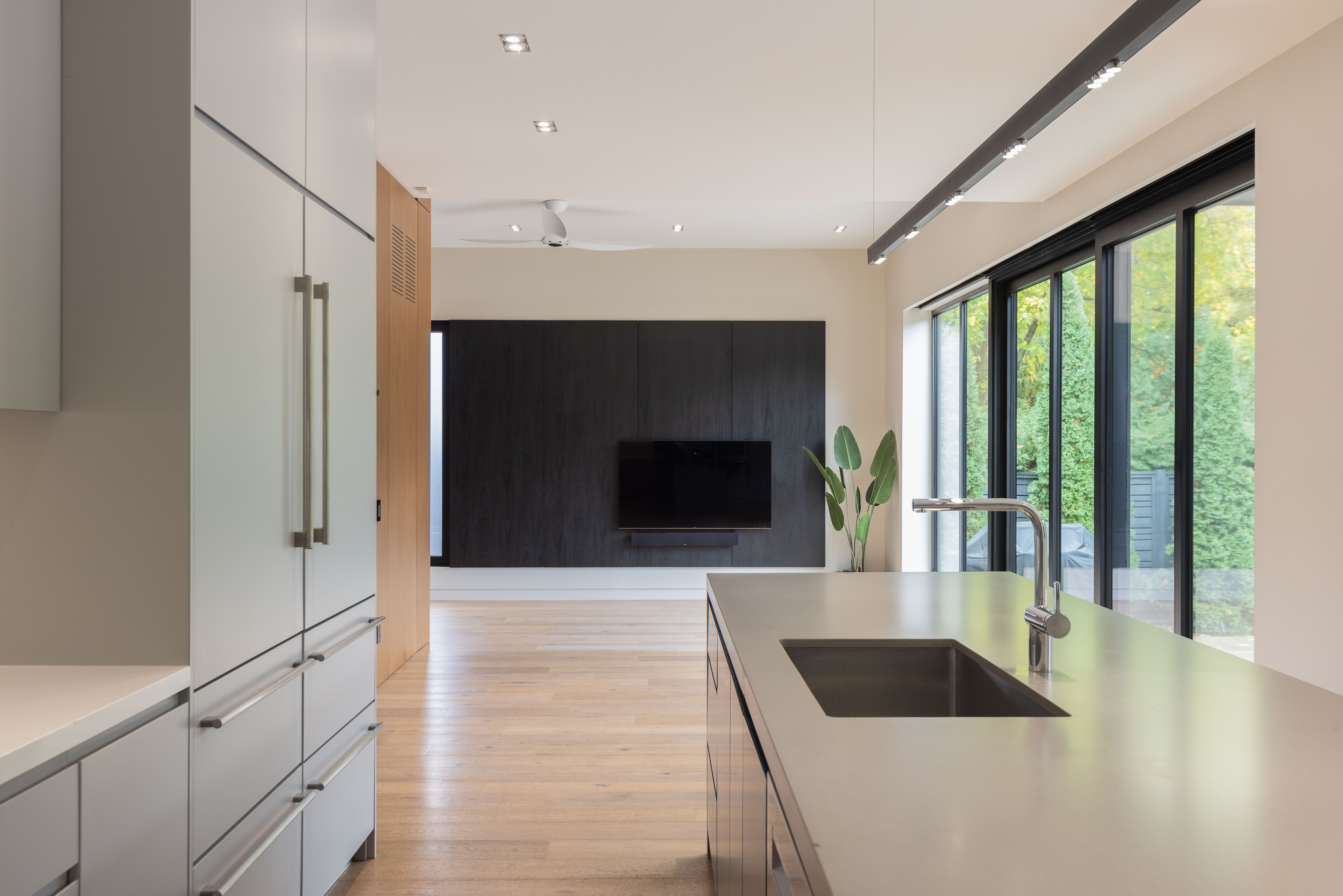 kitchen island with sunken sink and modern fixtures