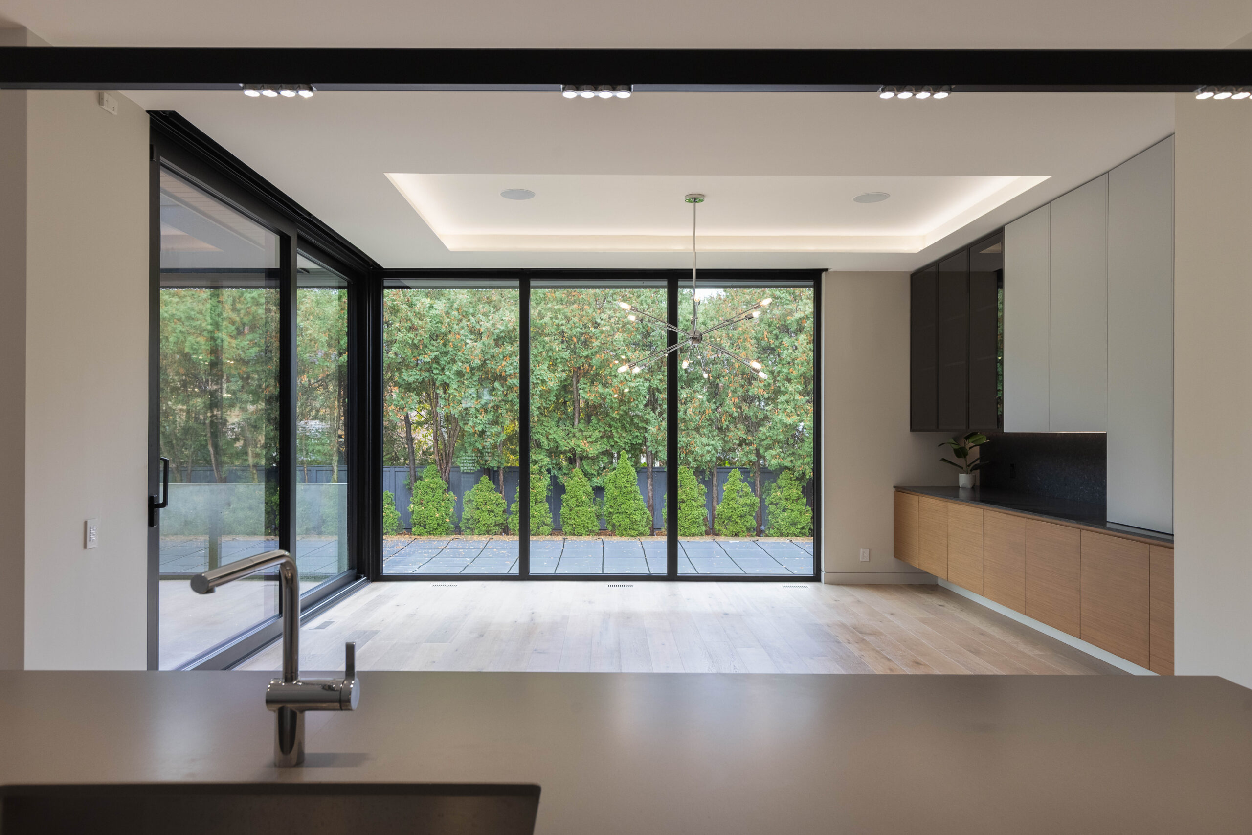 dining area surrounded by floor to ceiling glass