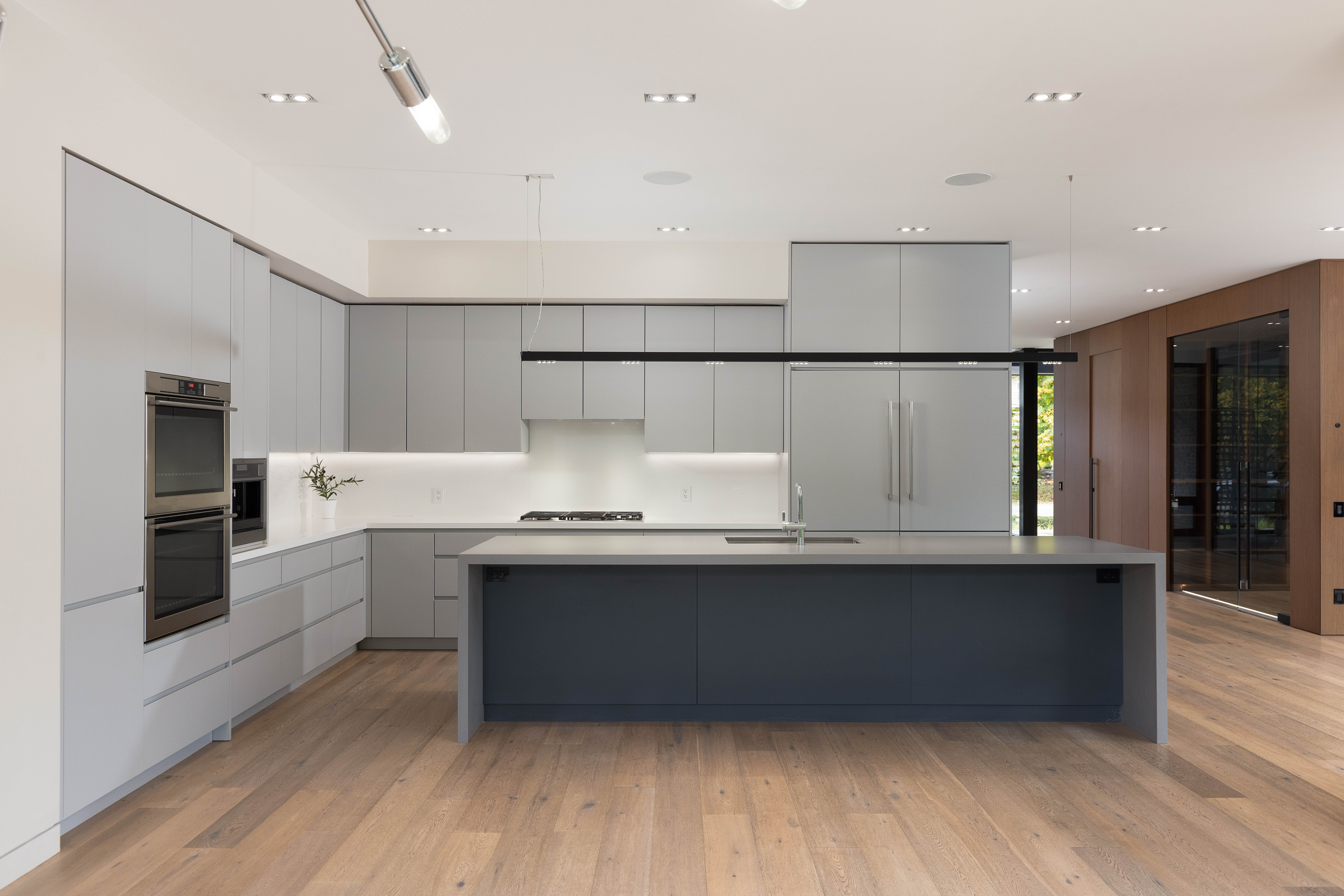 large custom kitchen with top of line stainless steel appliances