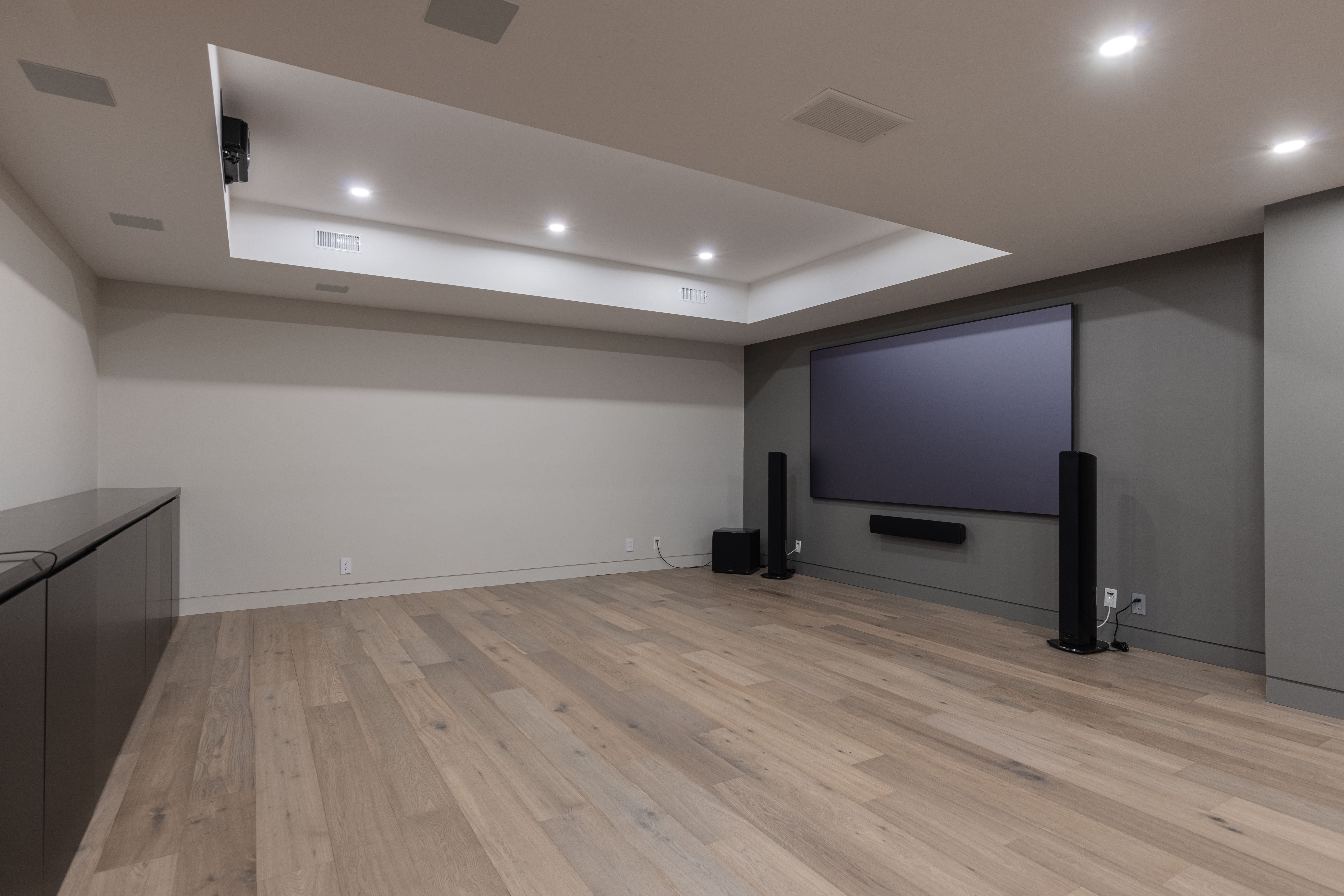 theater room with massive screen and surround sound