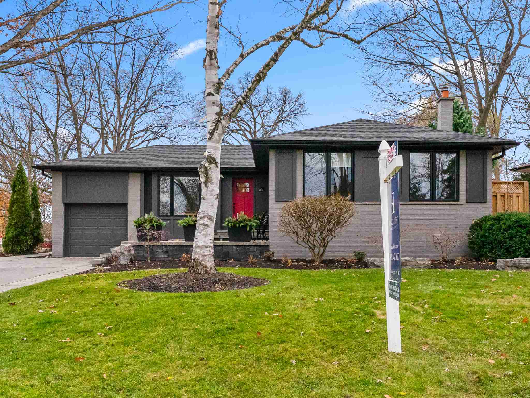 front view of house with dark window shutters