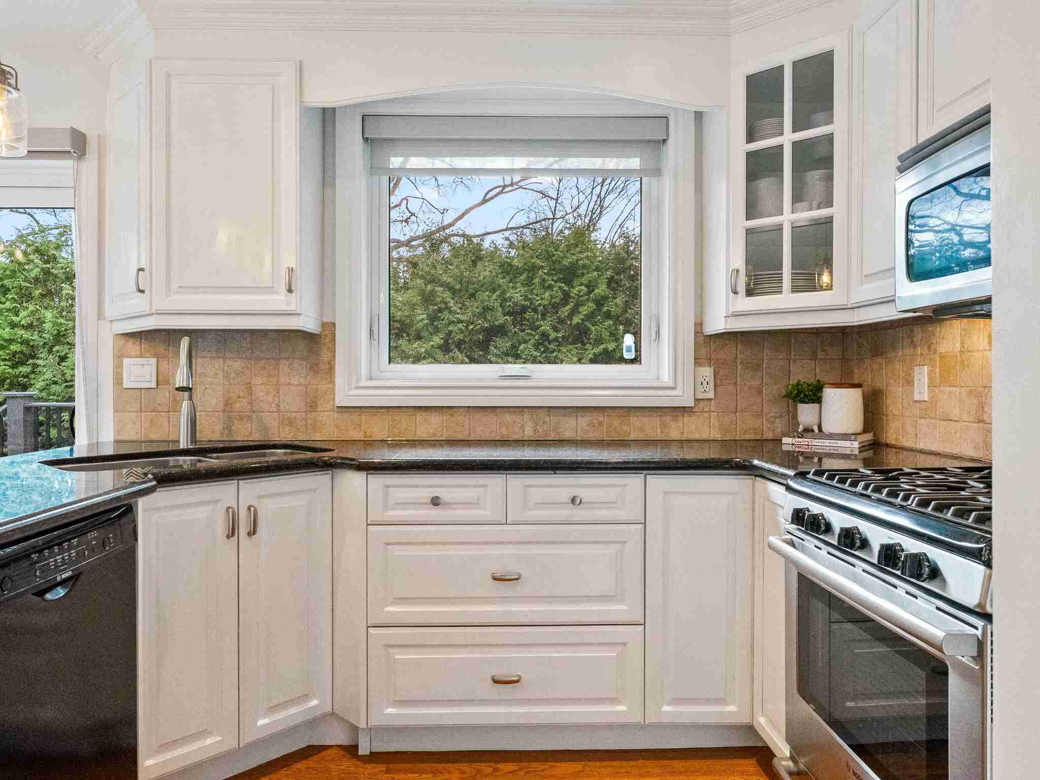 white kitchen cabinets and plenty of storage space