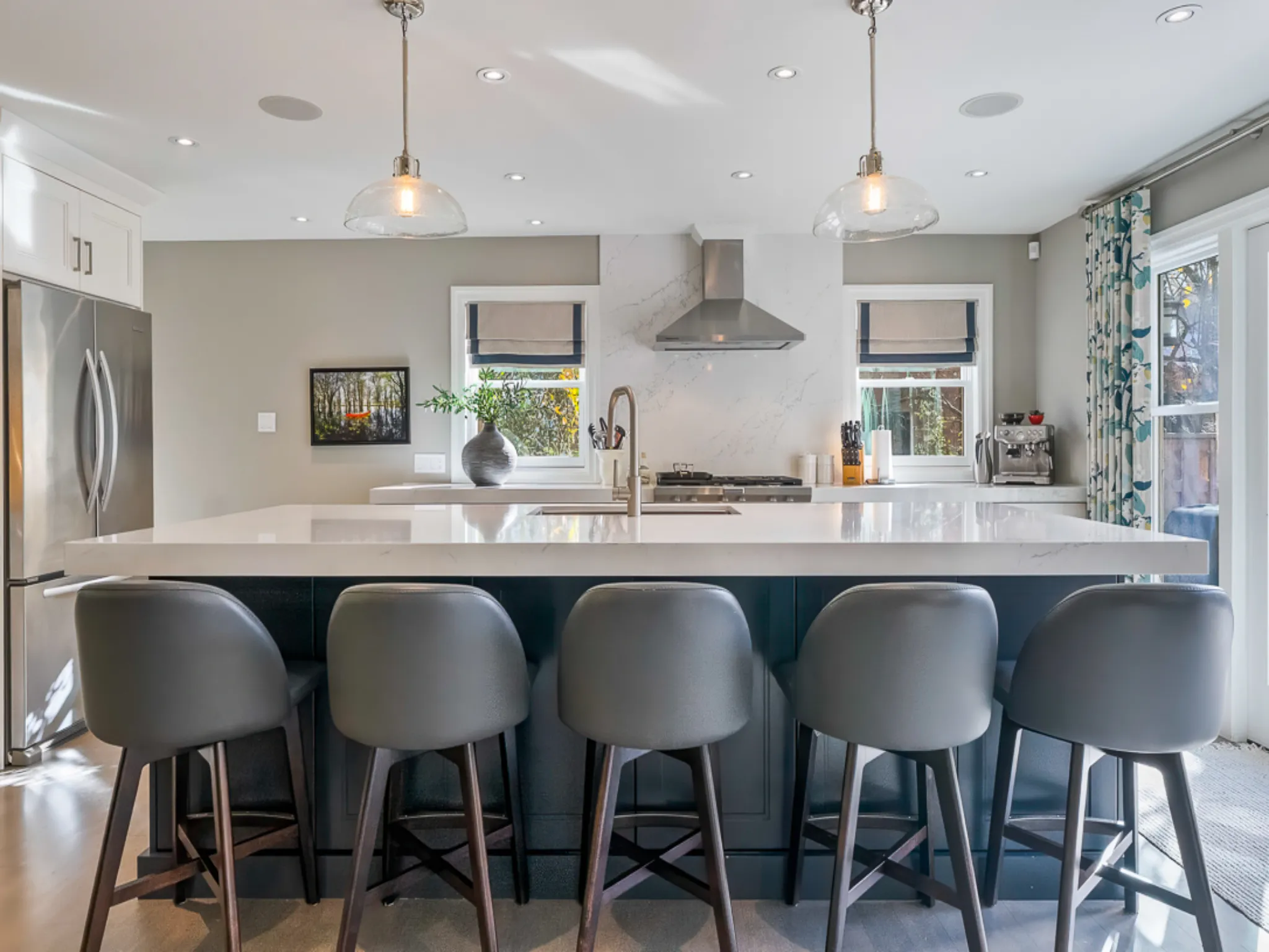 Modern kitchen with a large island and stylish bar stools