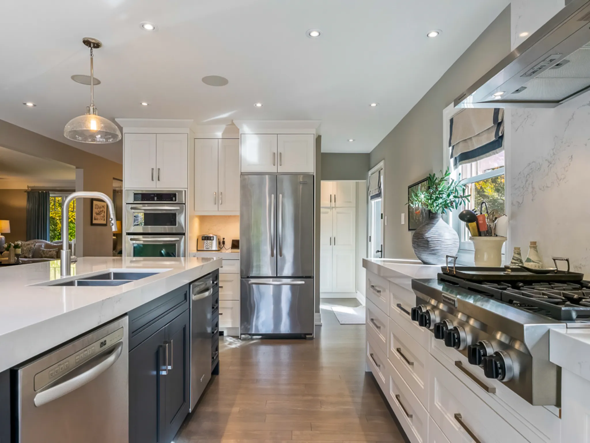 Modern kitchen with stainless steel appliances and white cabinetry