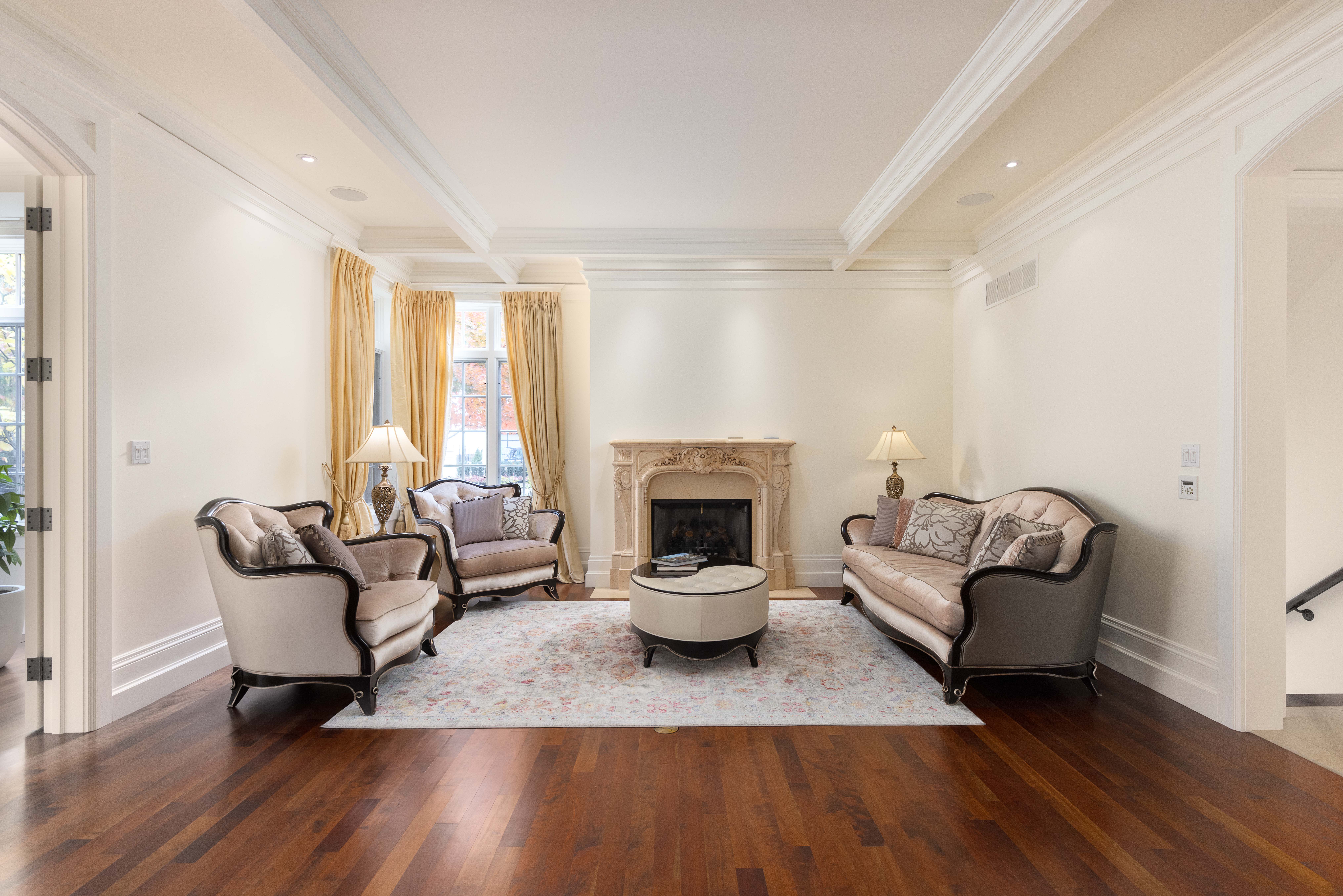 Elegant living room with plush seating and a fireplace