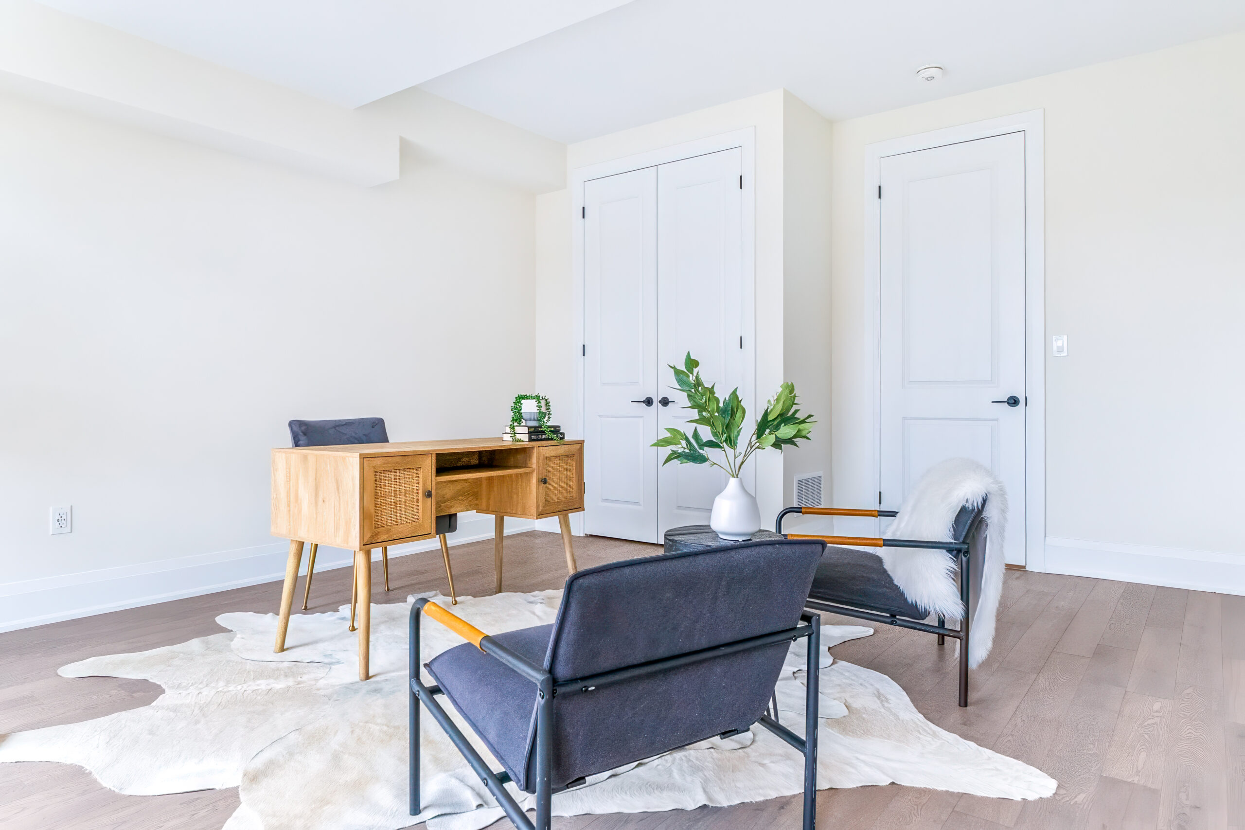 Bright office space with a wooden desk and modern chairs