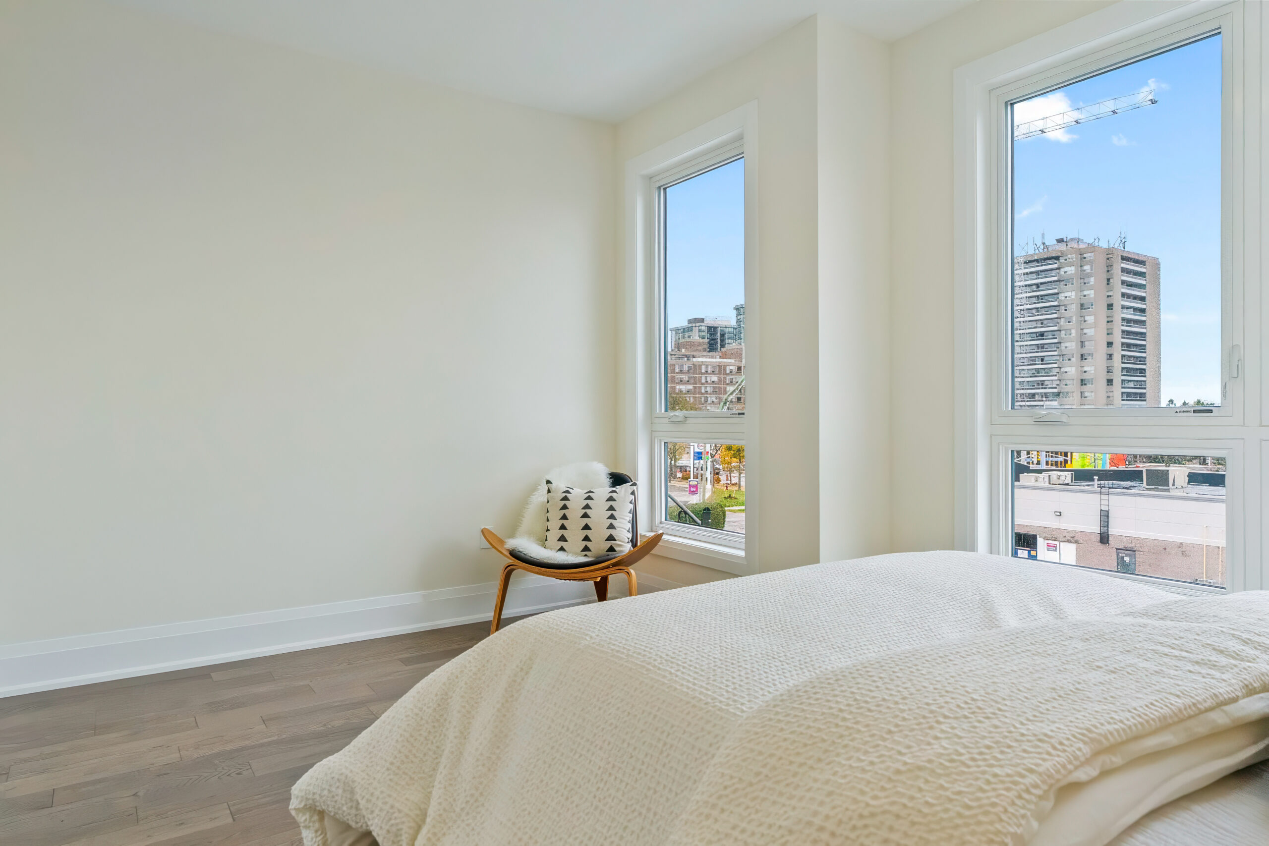 Bright bedroom with large windows and modern decor