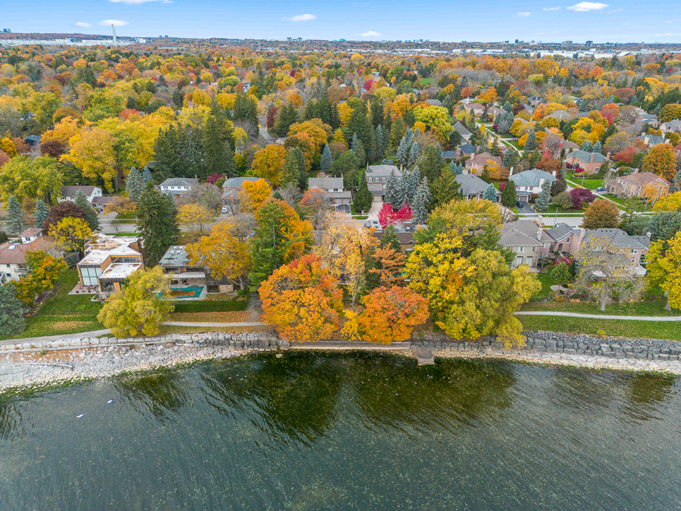 Aerial view of a colorful autumn neighborhood by the water