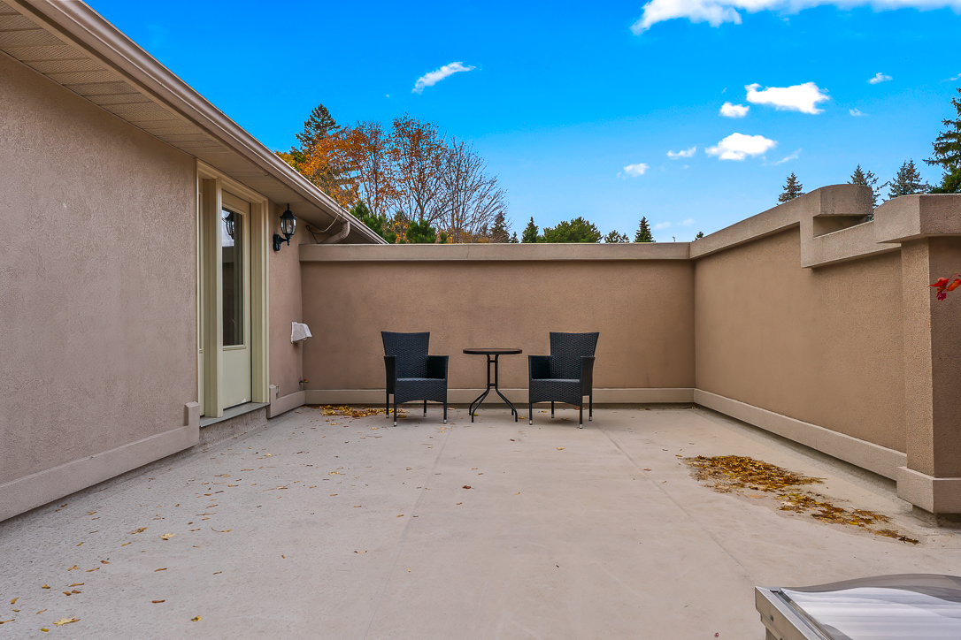 Cozy outdoor patio with two chairs and a small table
