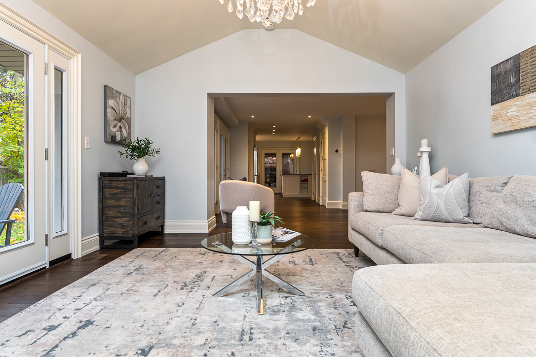 Cozy living room with a light-colored sofa and glass coffee table
