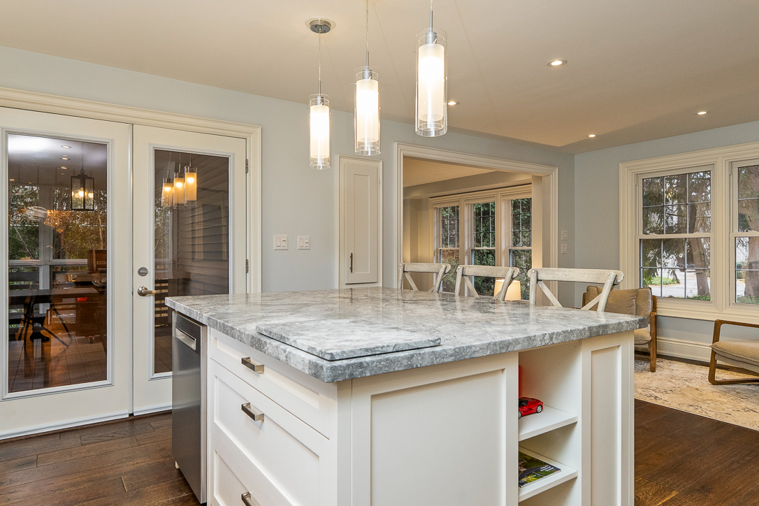 Modern kitchen with a marble island and pendant lighting
