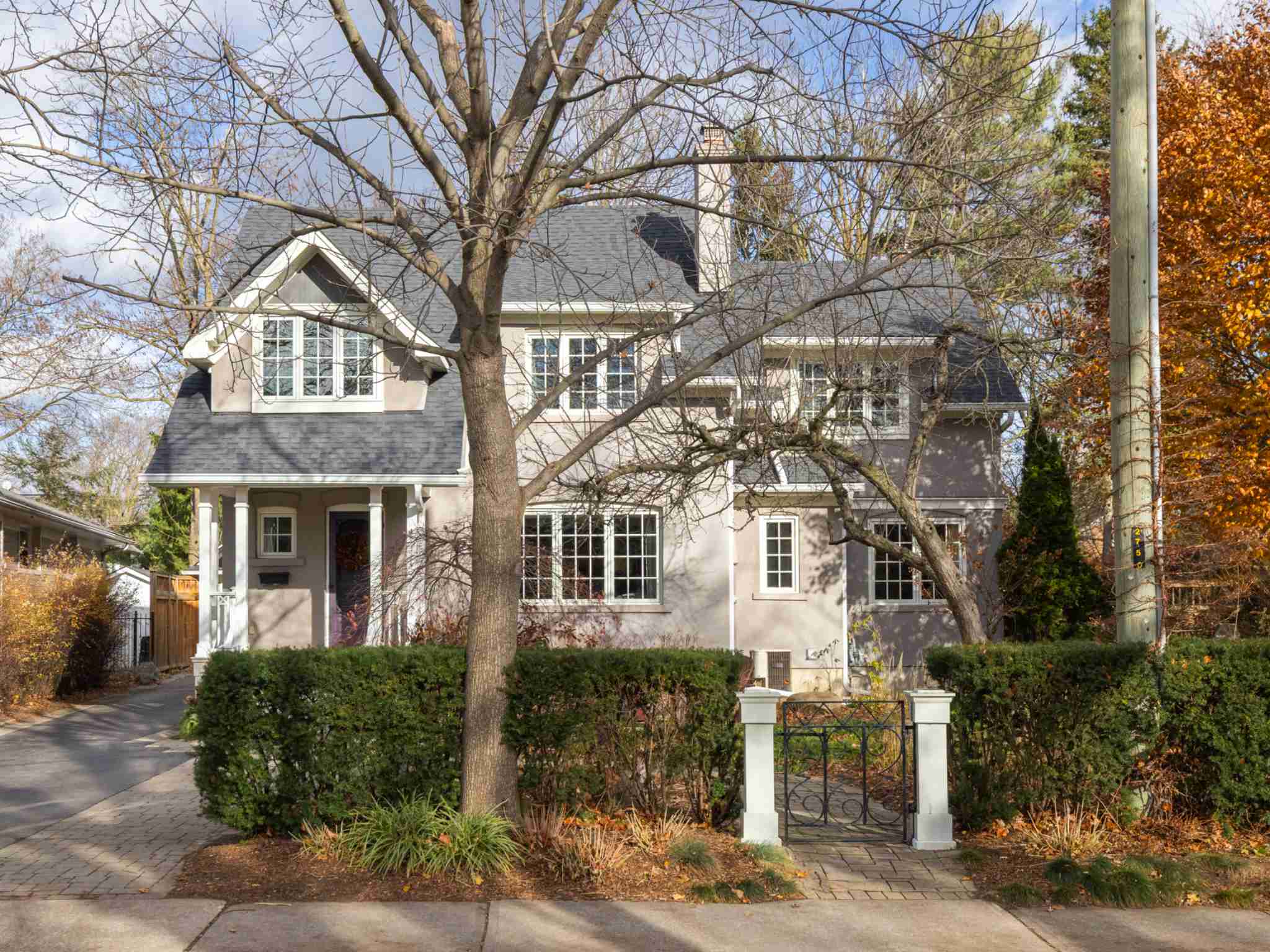 Front view of house with gated walk way to front door