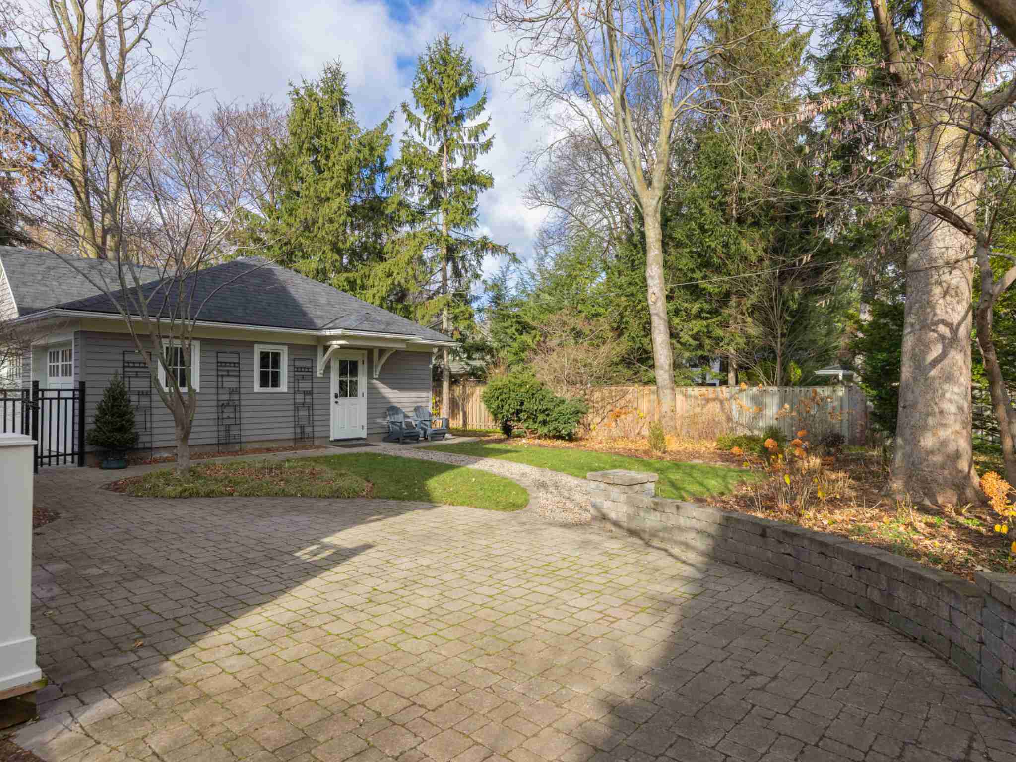 Backyard with stone patio and large green space