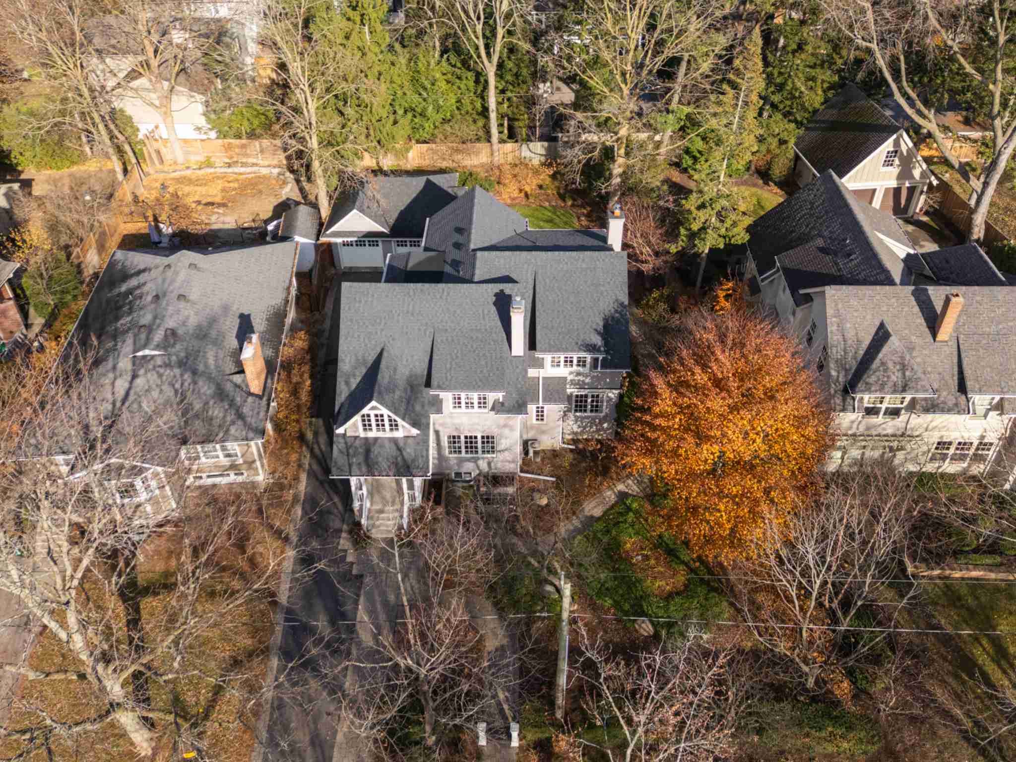 Drone shot of house showing lot size and mature trees