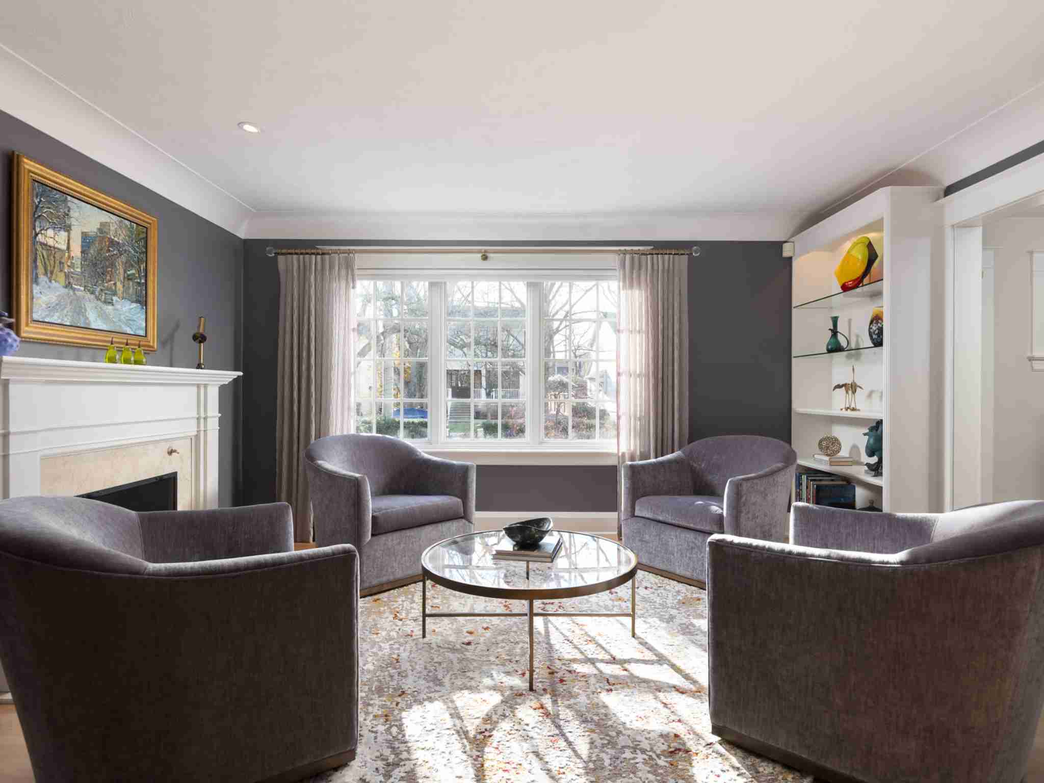 Living room with large window and fireplace