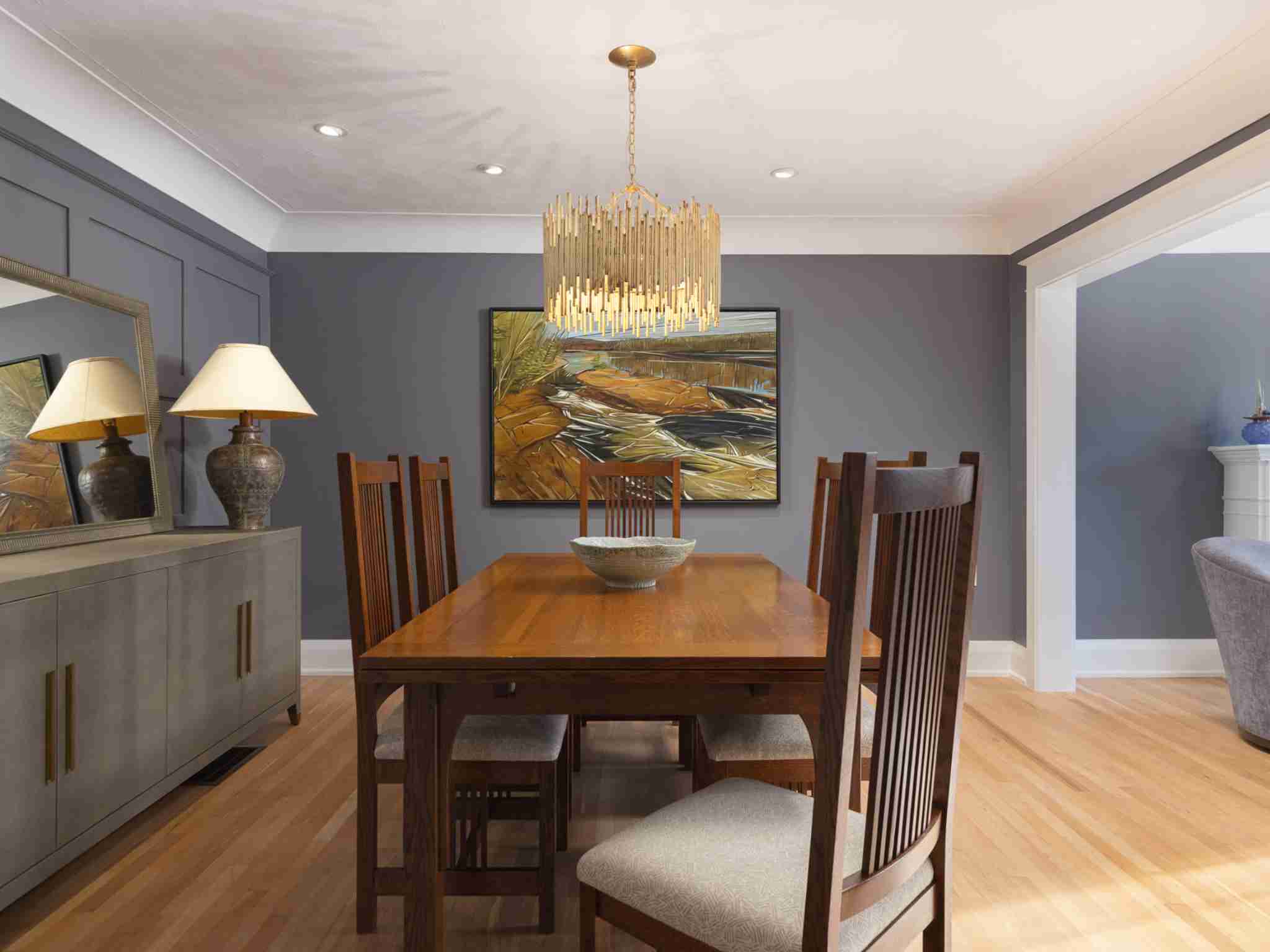 Dining room with gold light fixture