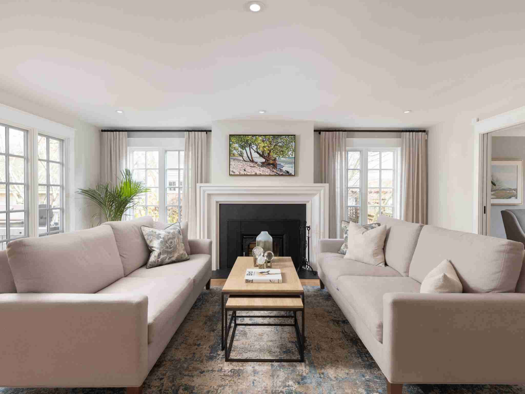 Family room with over sized fireplace and large windows