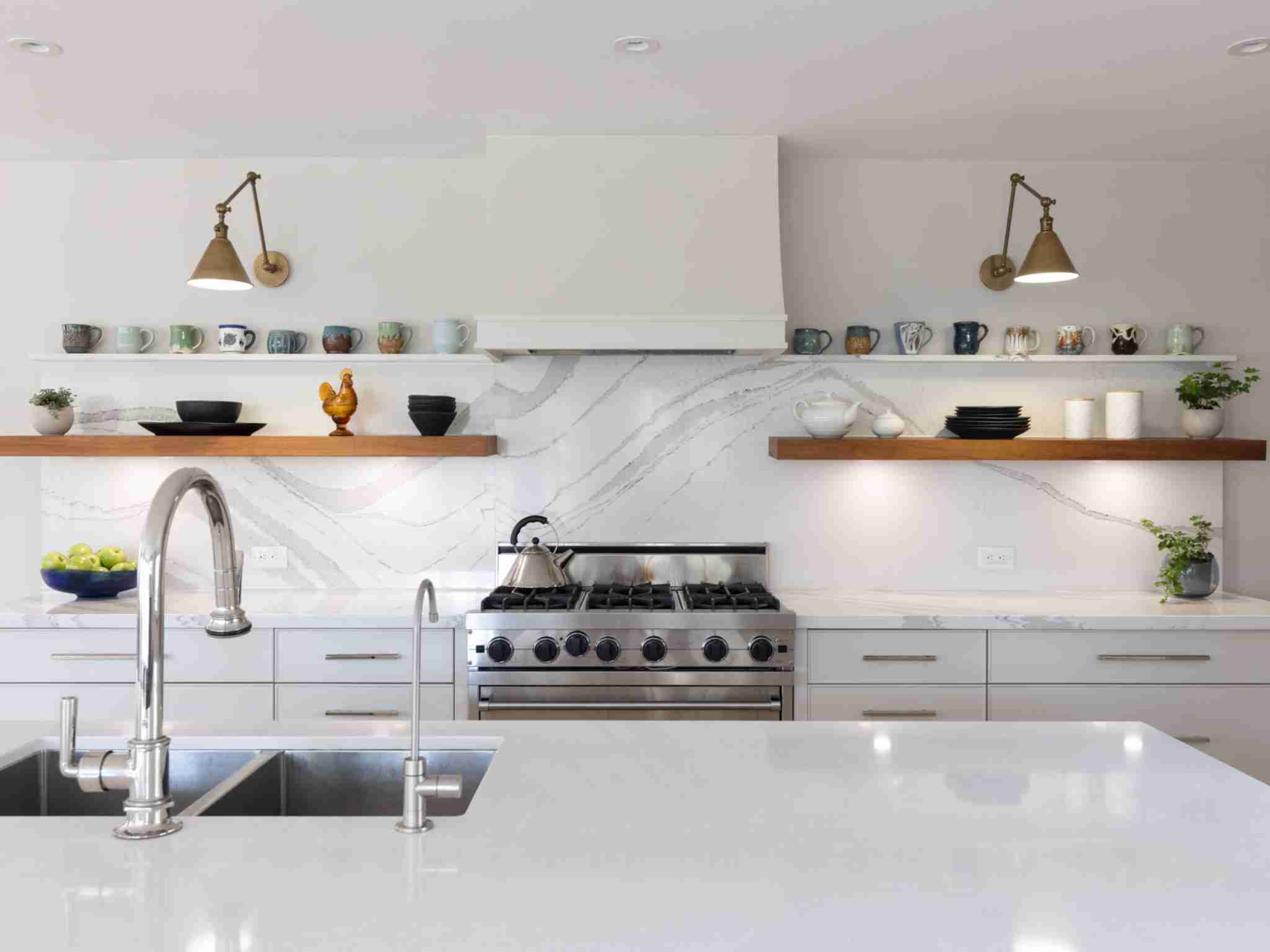 built in sink in the island. Custom range hood over stove