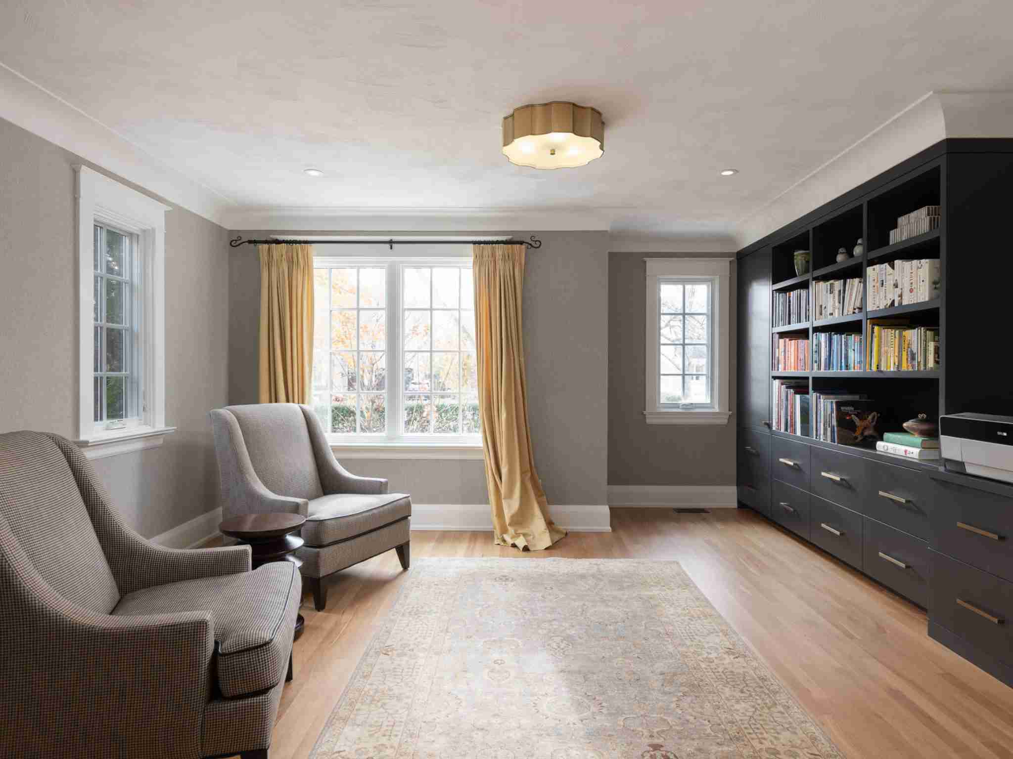 large office area with built in book shelves