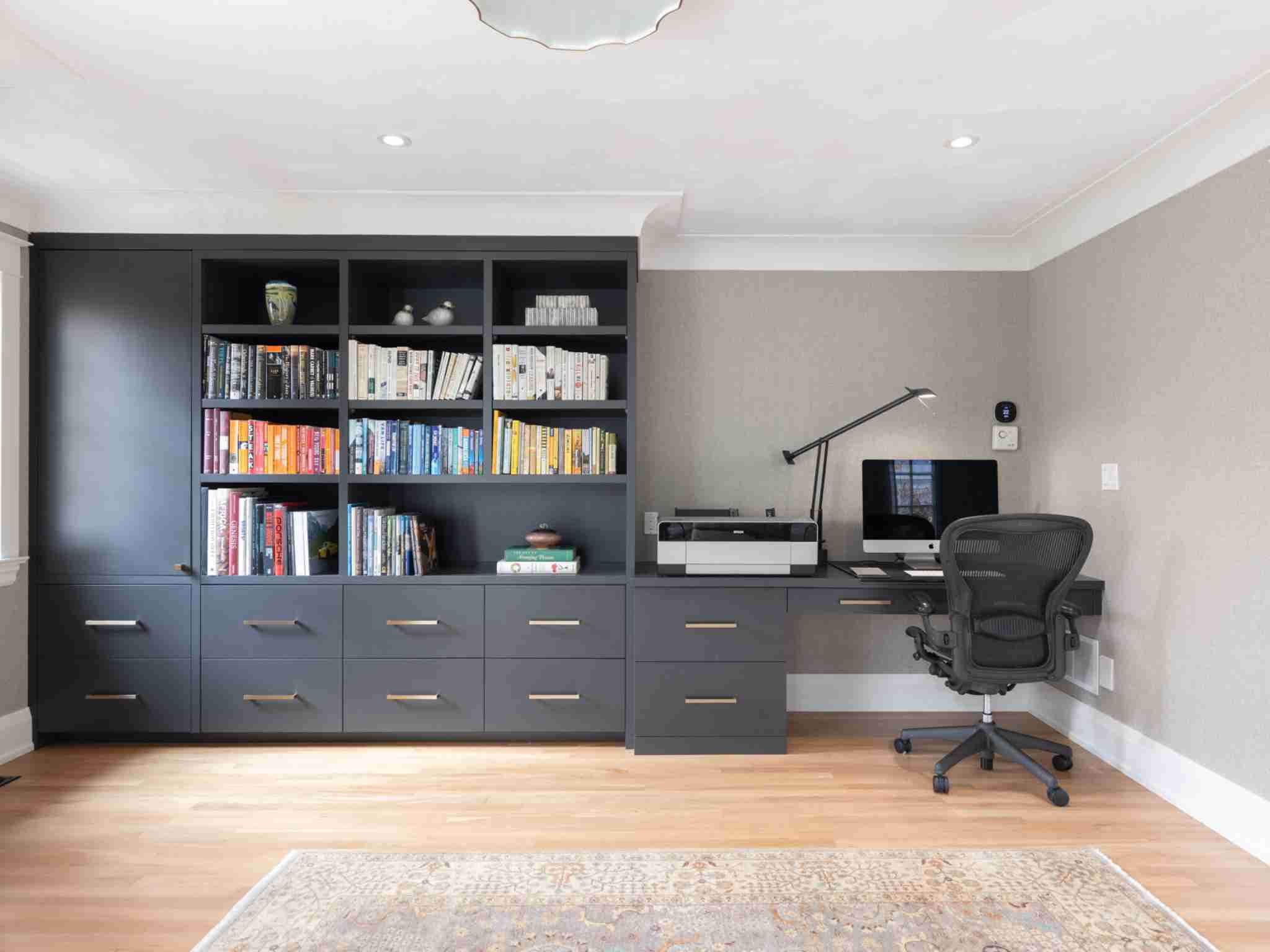Office with computer area and book shelf
