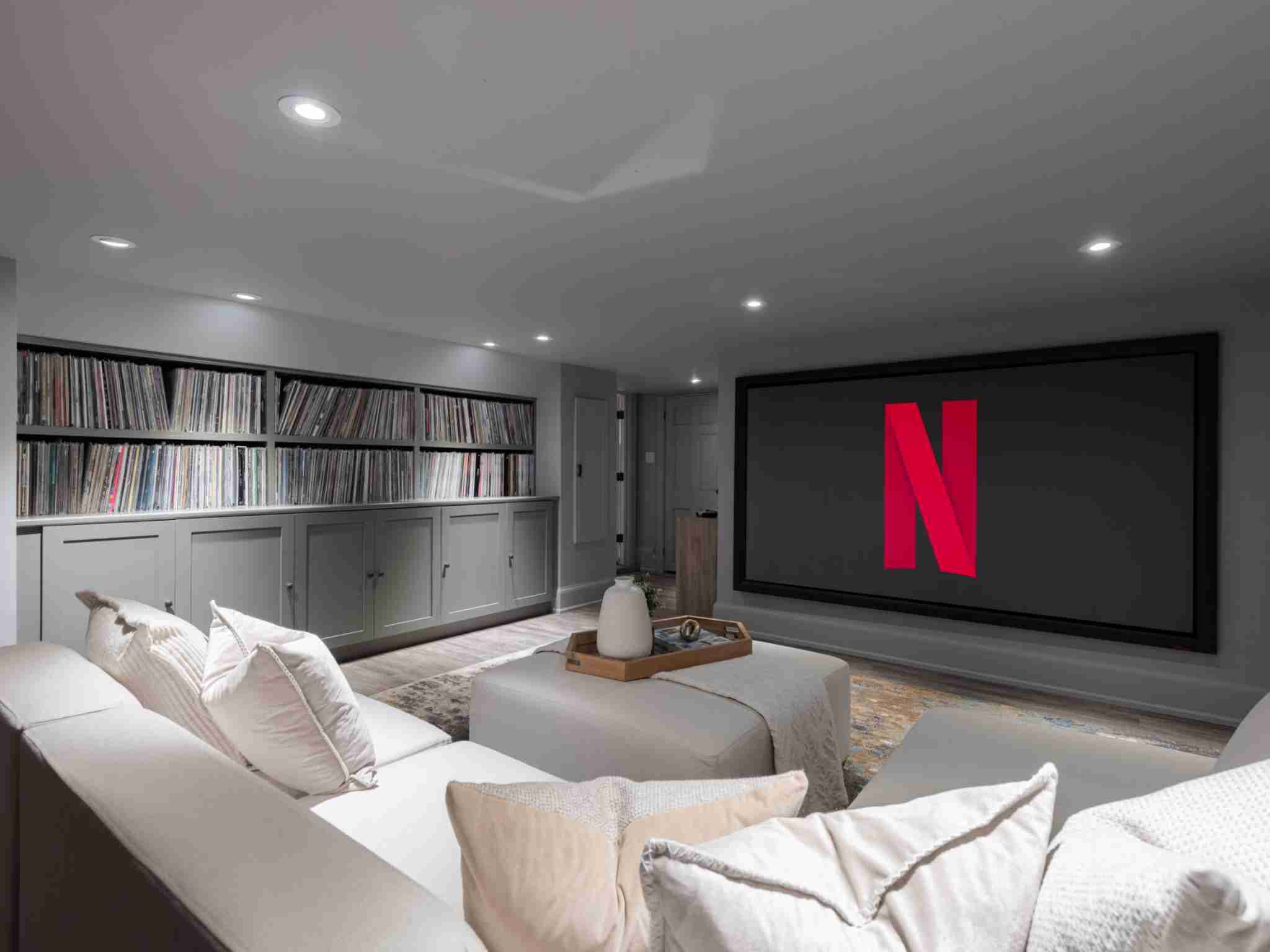 Large basement entertainment room with built in screen